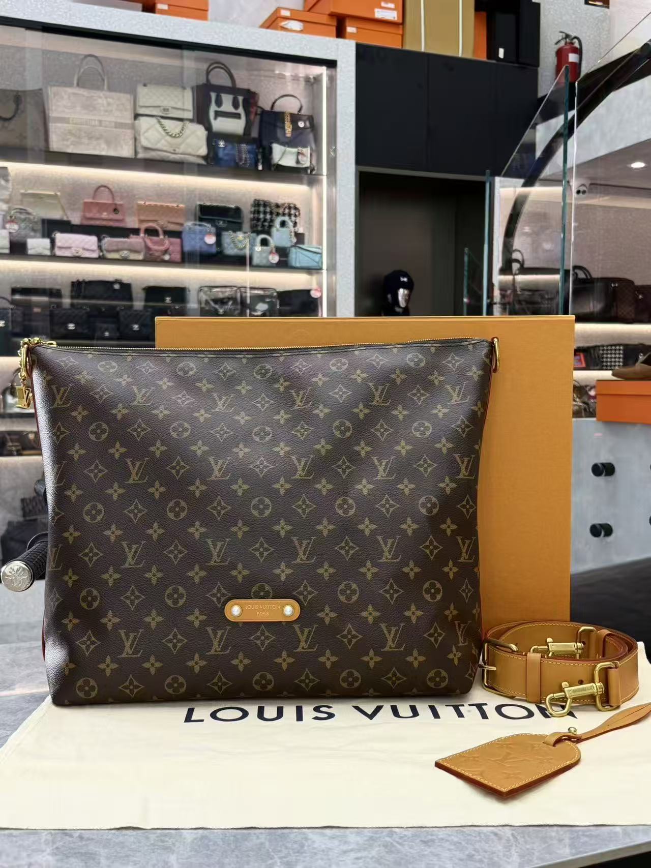 Louis Vuitton Vagabond Hobo bag in monogram coated canvas with vachetta leather trim and gold-toned hardware