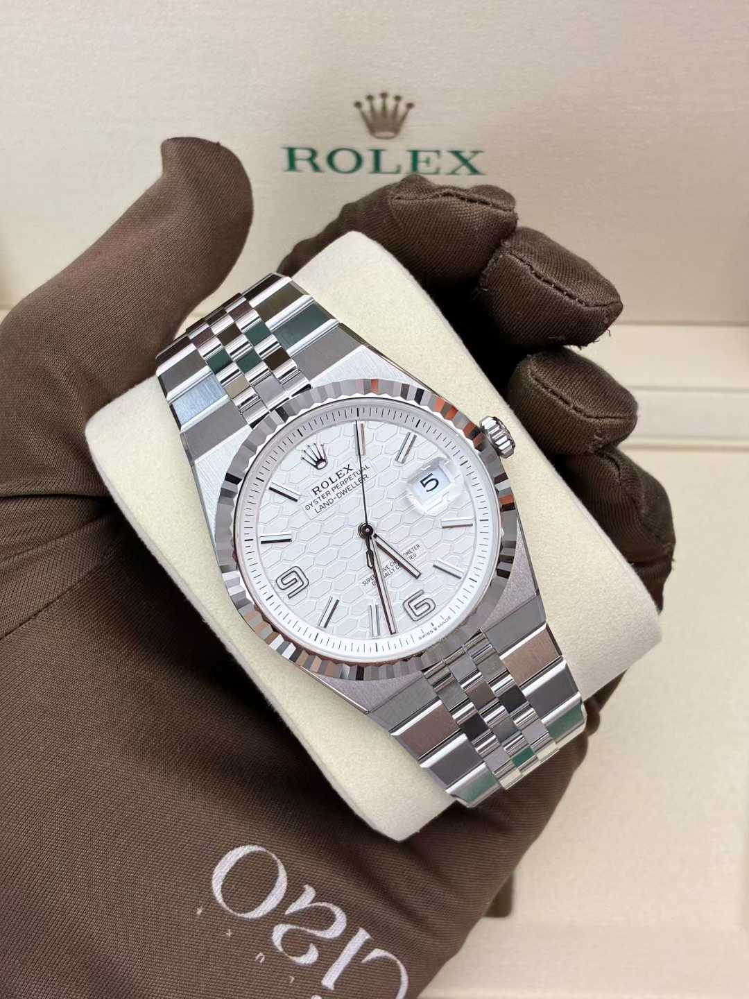 Rolex Land-Dweller 40mm Oystersteel case paired with an elegant 18k white gold fluted bezel