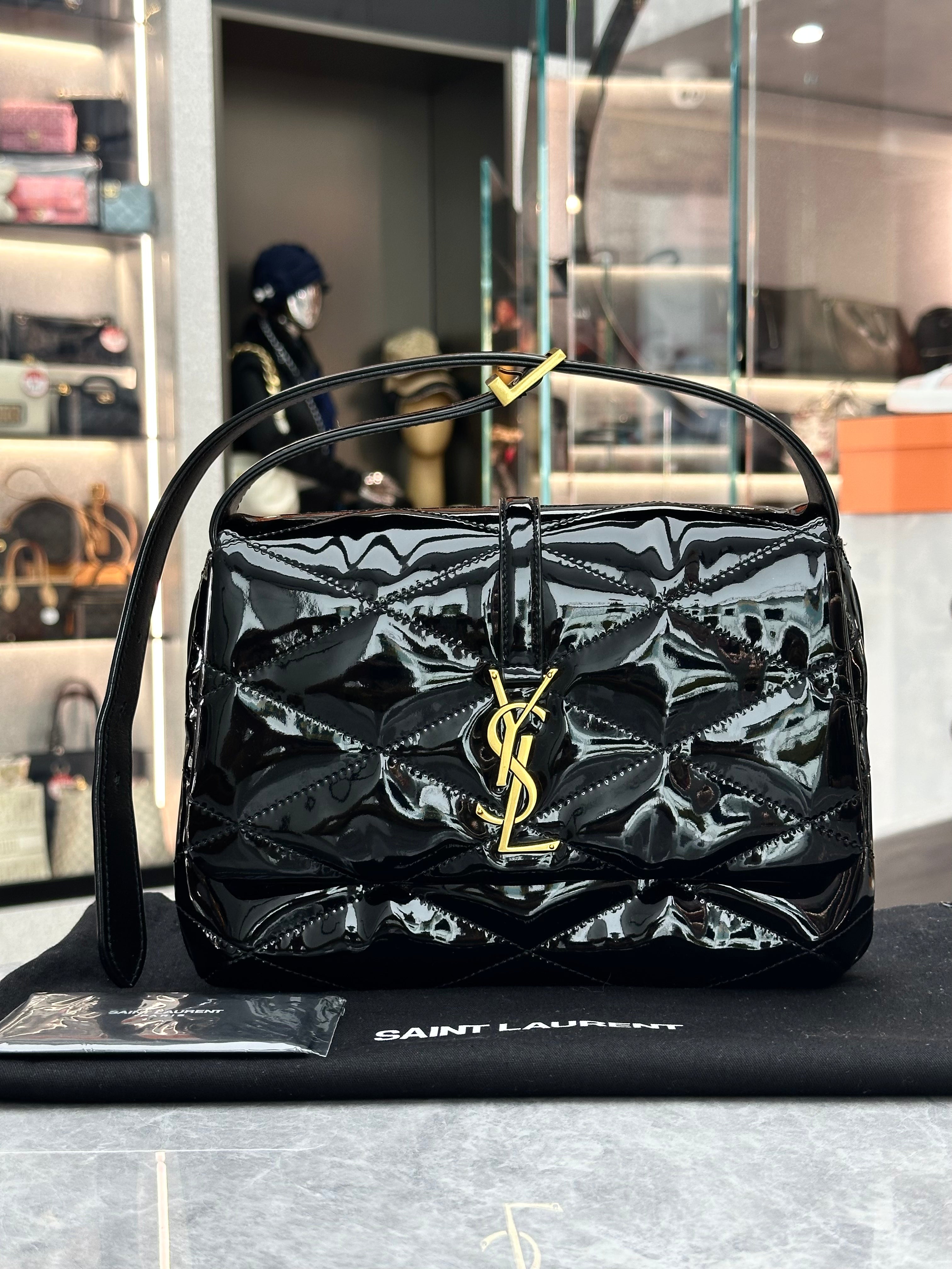 Saint Laurent Le 57 or Le 5 à 7 quilted patent leather shoulder bag in black with gold-toned hardware