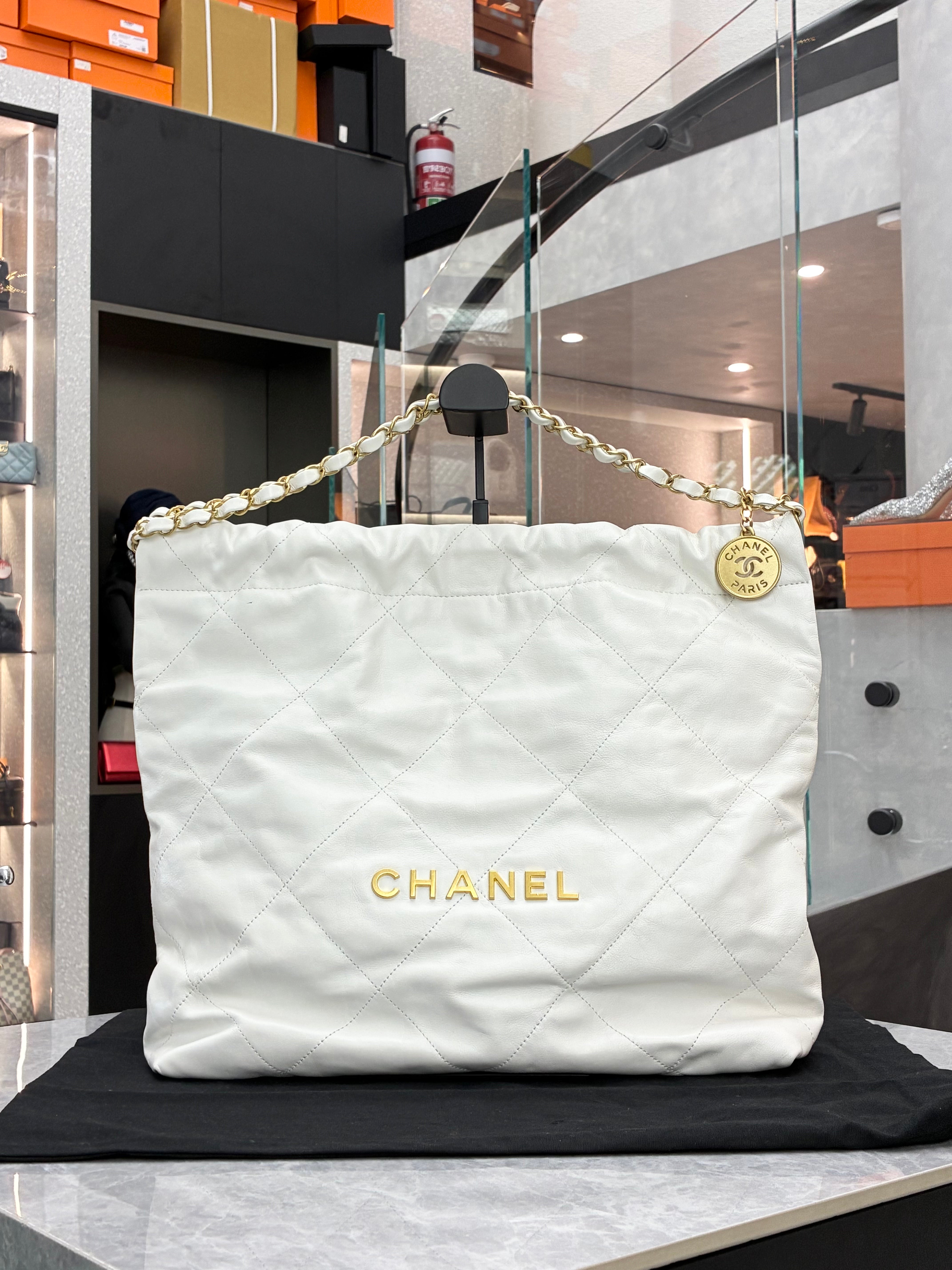 Chanel 22 Hobo bag in a small size, made of white calfskin leather with gold-tone hardware