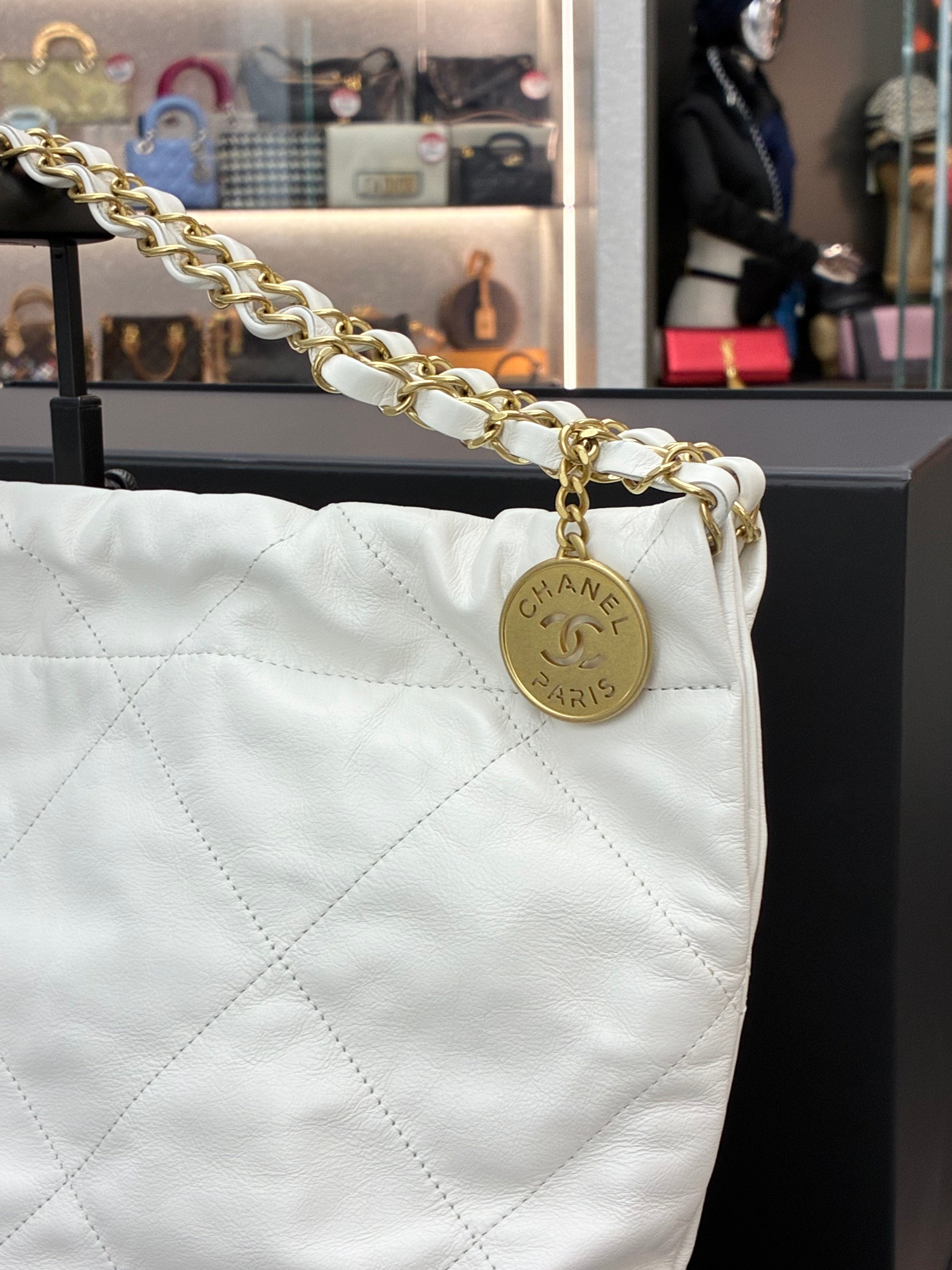 Chanel 22 Hobo bag in a small size, made of white calfskin leather with gold-tone hardware