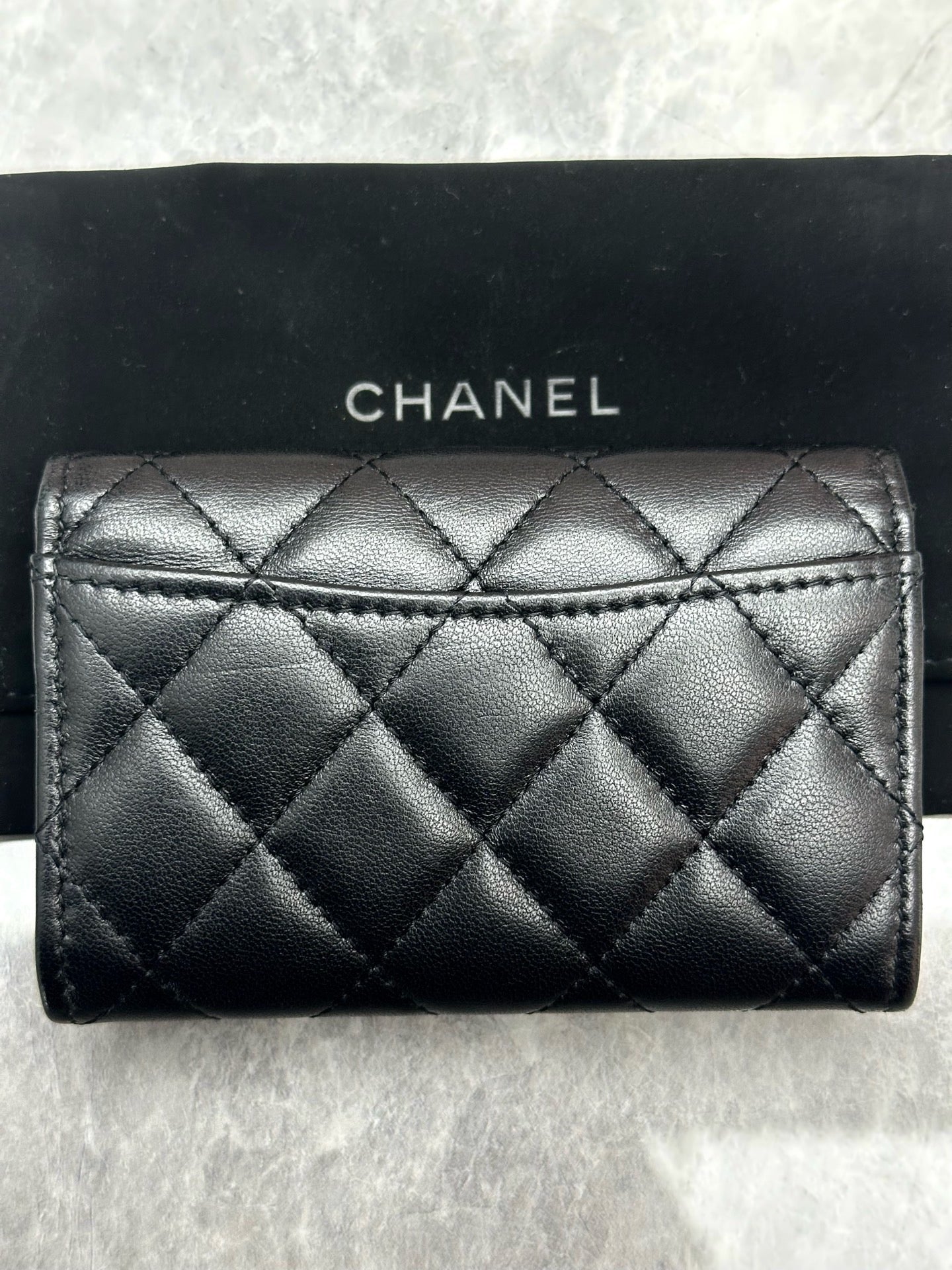 Chanel Classic Card Holder in black quilted lambskin leather with gold tone hardware