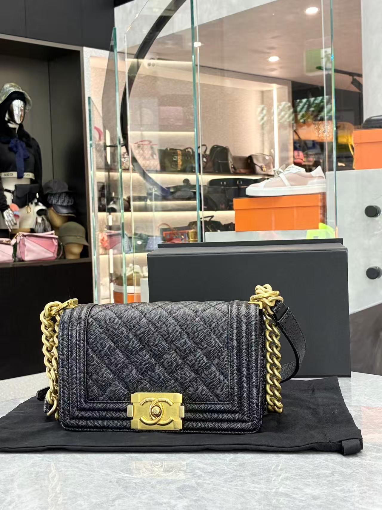 Chanel Boy Chanel chain shoulder bag in black caviar leather with gold-tone hardware