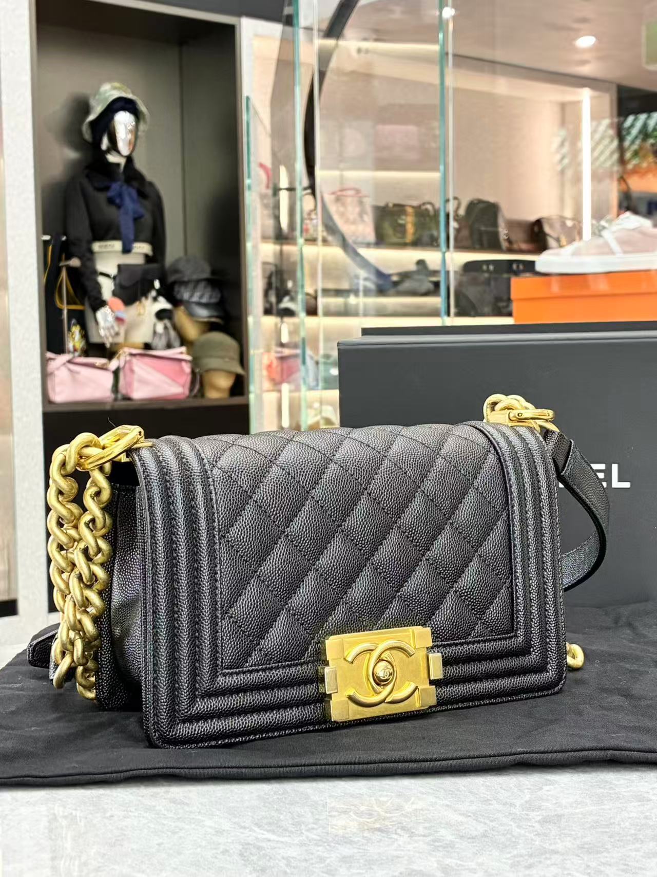 Chanel Boy Chanel chain shoulder bag in black caviar leather with gold-tone hardware