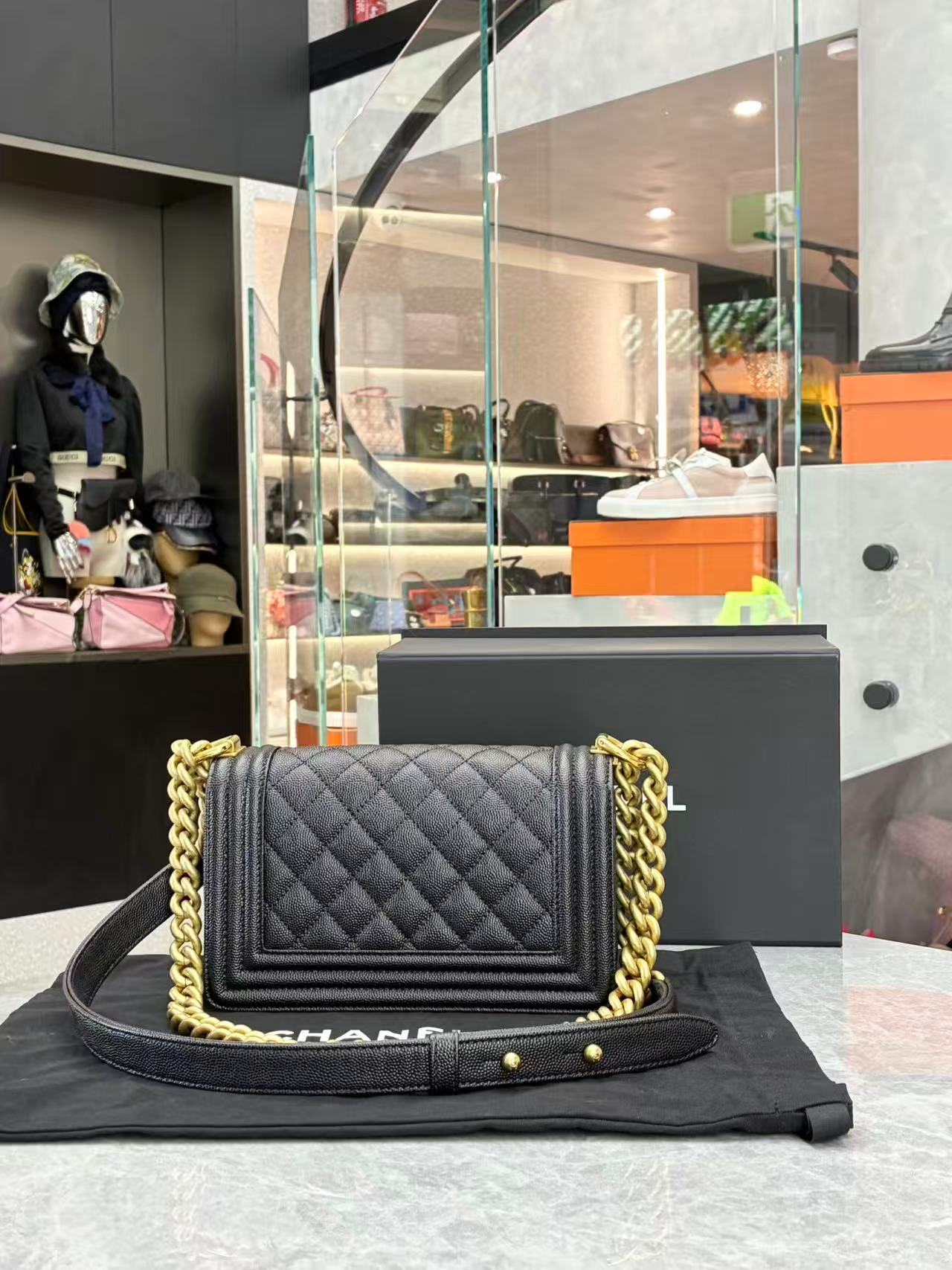 Chanel Boy Chanel chain shoulder bag in black caviar leather with gold-tone hardware