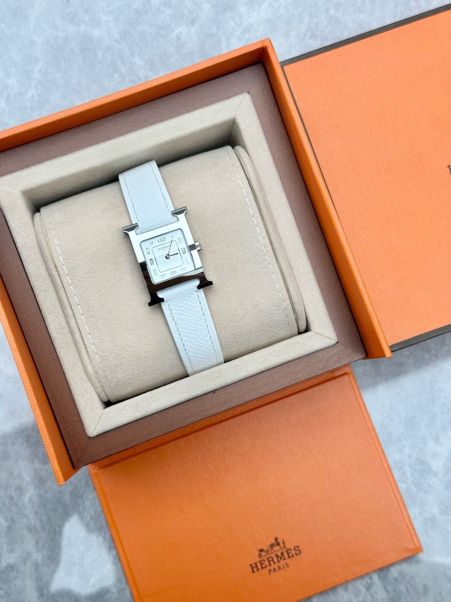 Hermès Heure H small model watch in stainless steel with a white Epsom calfskin strap