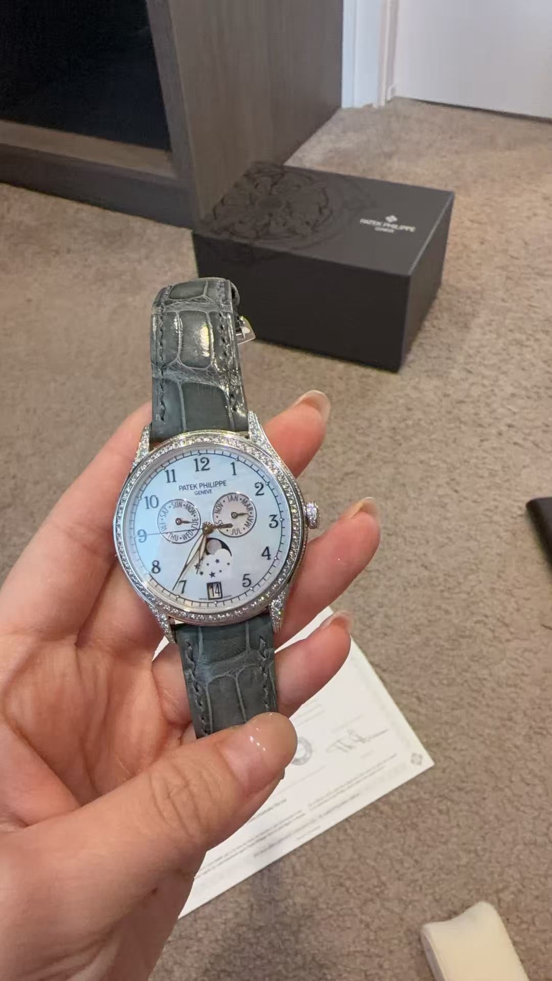 Patek Philippe Complications 4948G-010 watch, featuring a diamond-set white gold case and a mother-of-pearl dial
