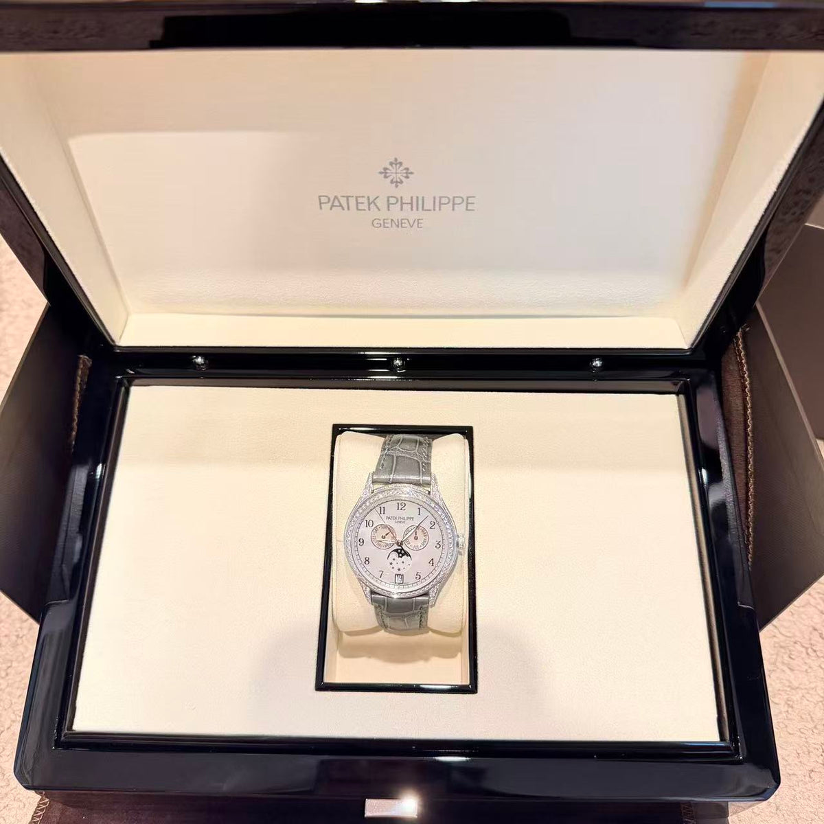 Patek Philippe Complications 4948G-010 watch, featuring a diamond-set white gold case and a mother-of-pearl dial