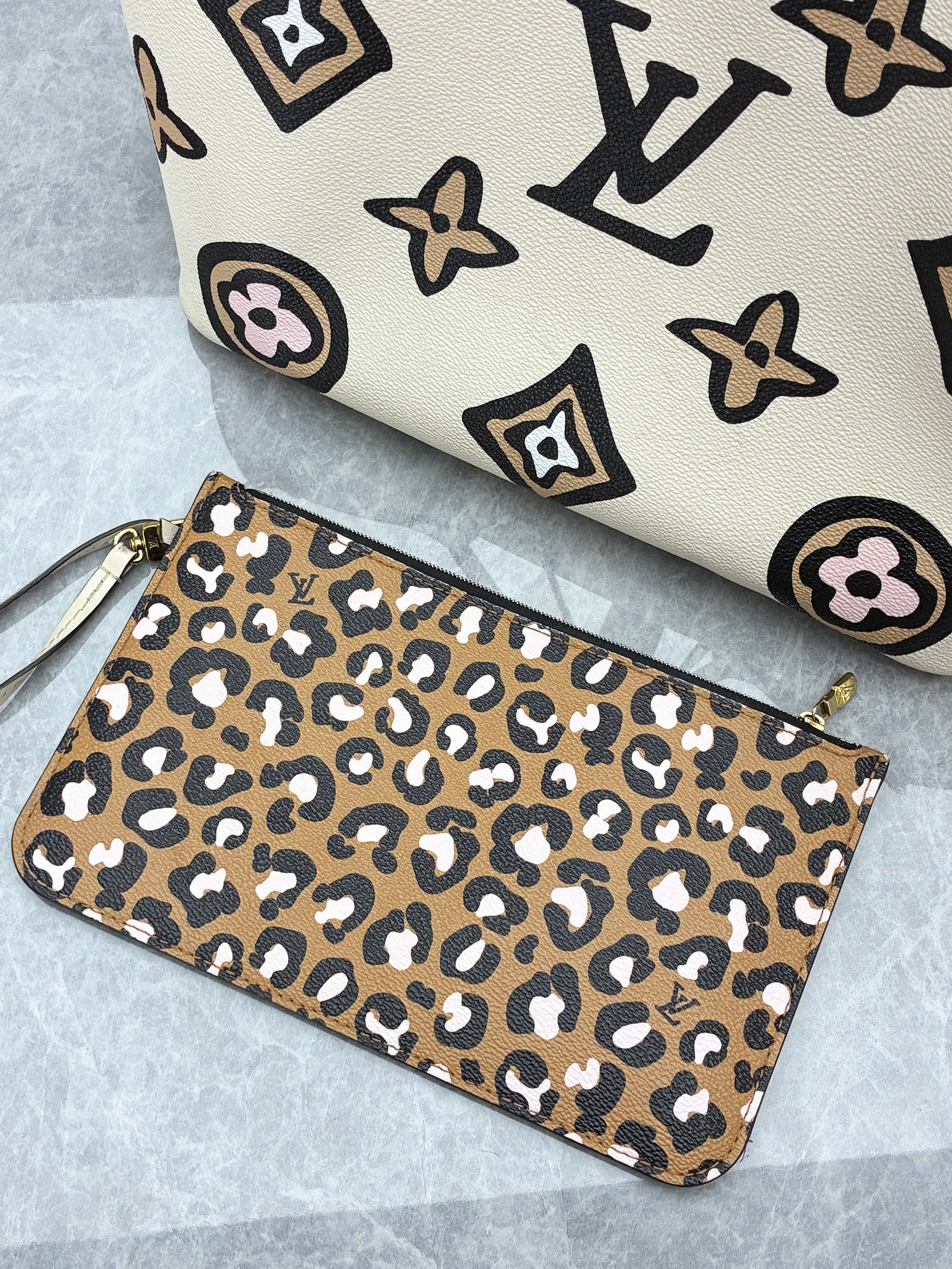 Louis Vuitton Neverfull MM tote bag from the 2021 Fall "Wild at Heart" capsule collection, featuring a cream monogram print with a leopard-print zipped pouch