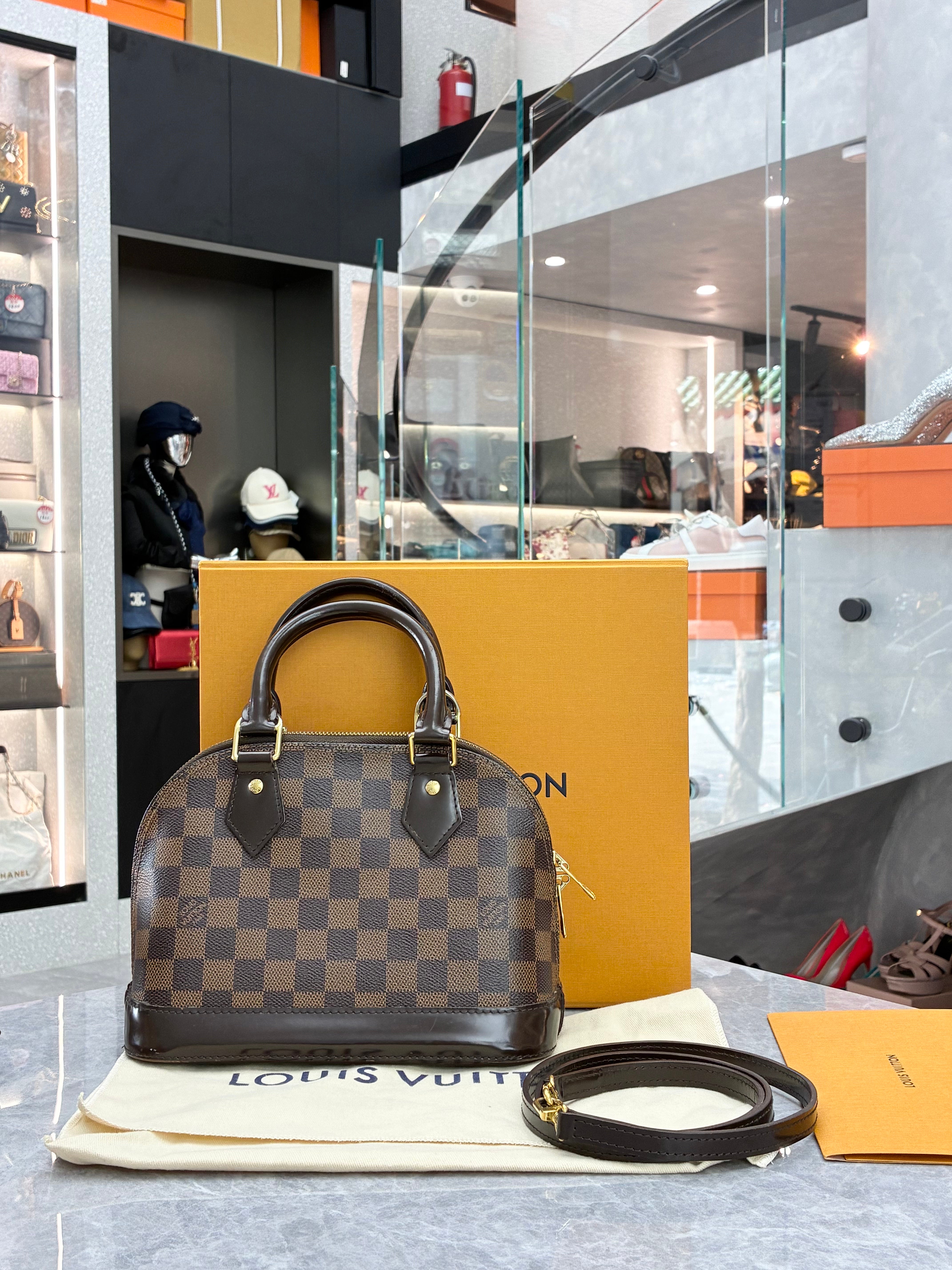 Louis Vuitton Alma BB bag in Damier Ebene canvas