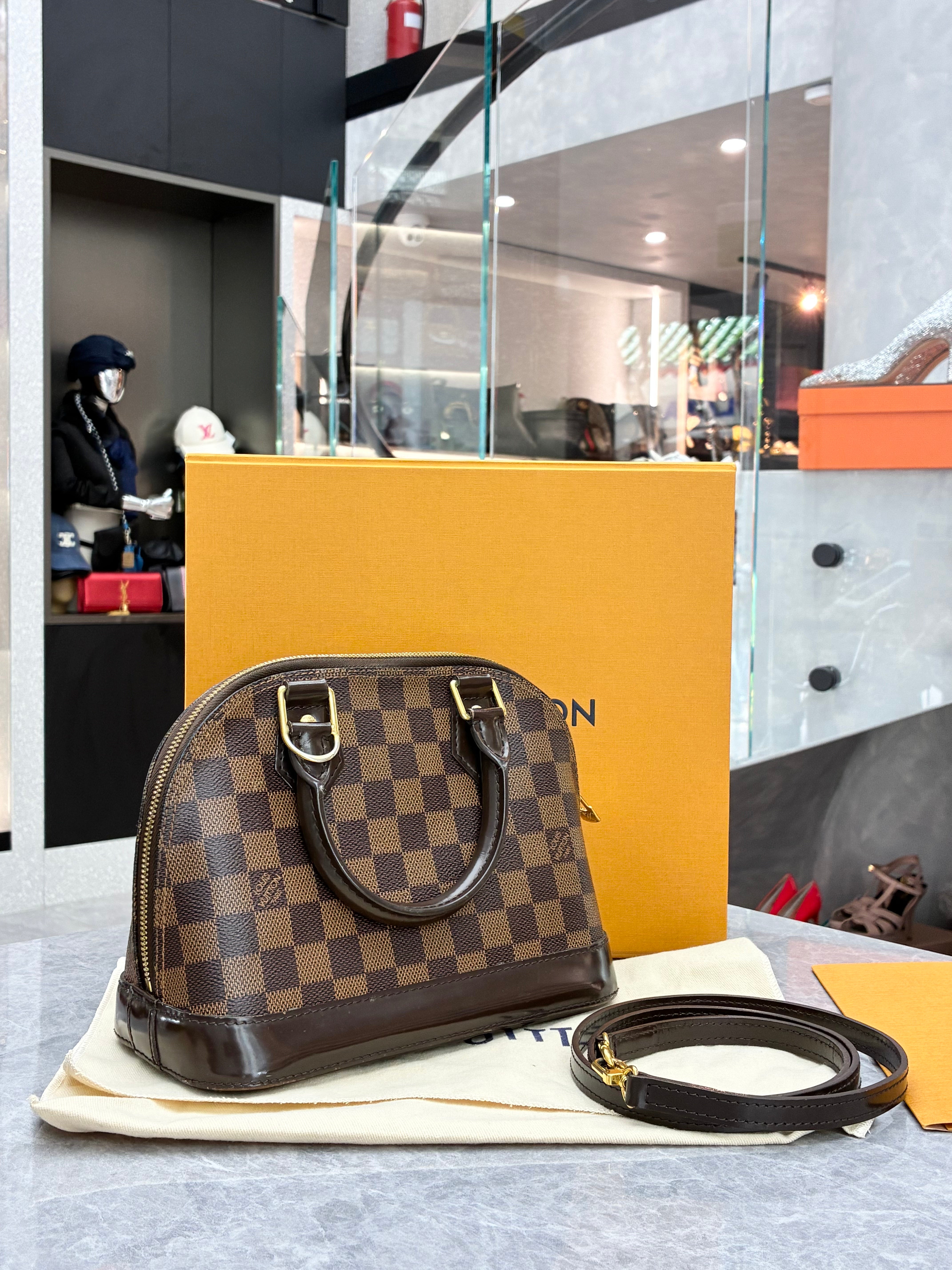 Louis Vuitton Alma BB bag in Damier Ebene canvas