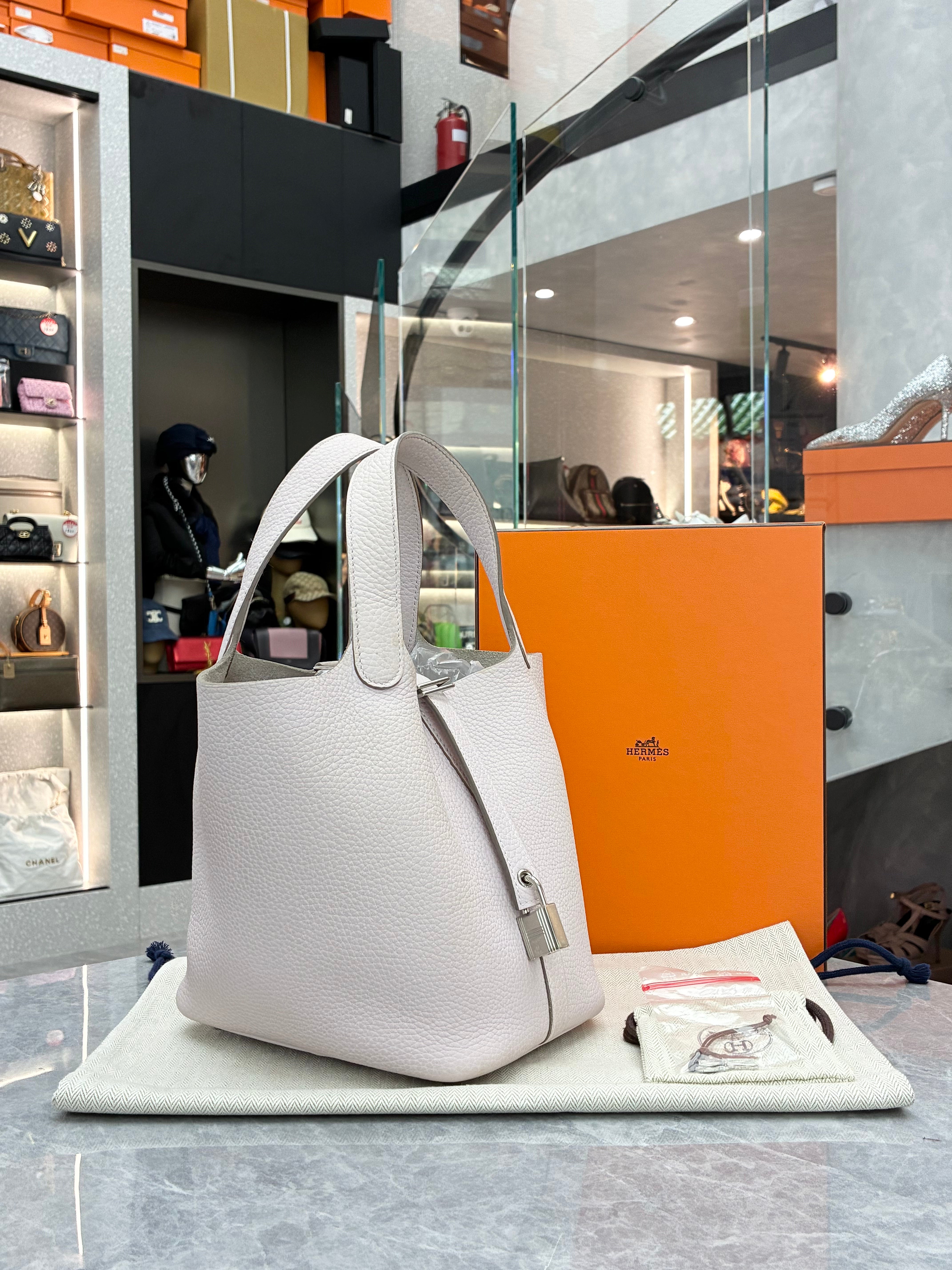 Hermès Picotin Lock 18 bag in a light grey color with silver hardware