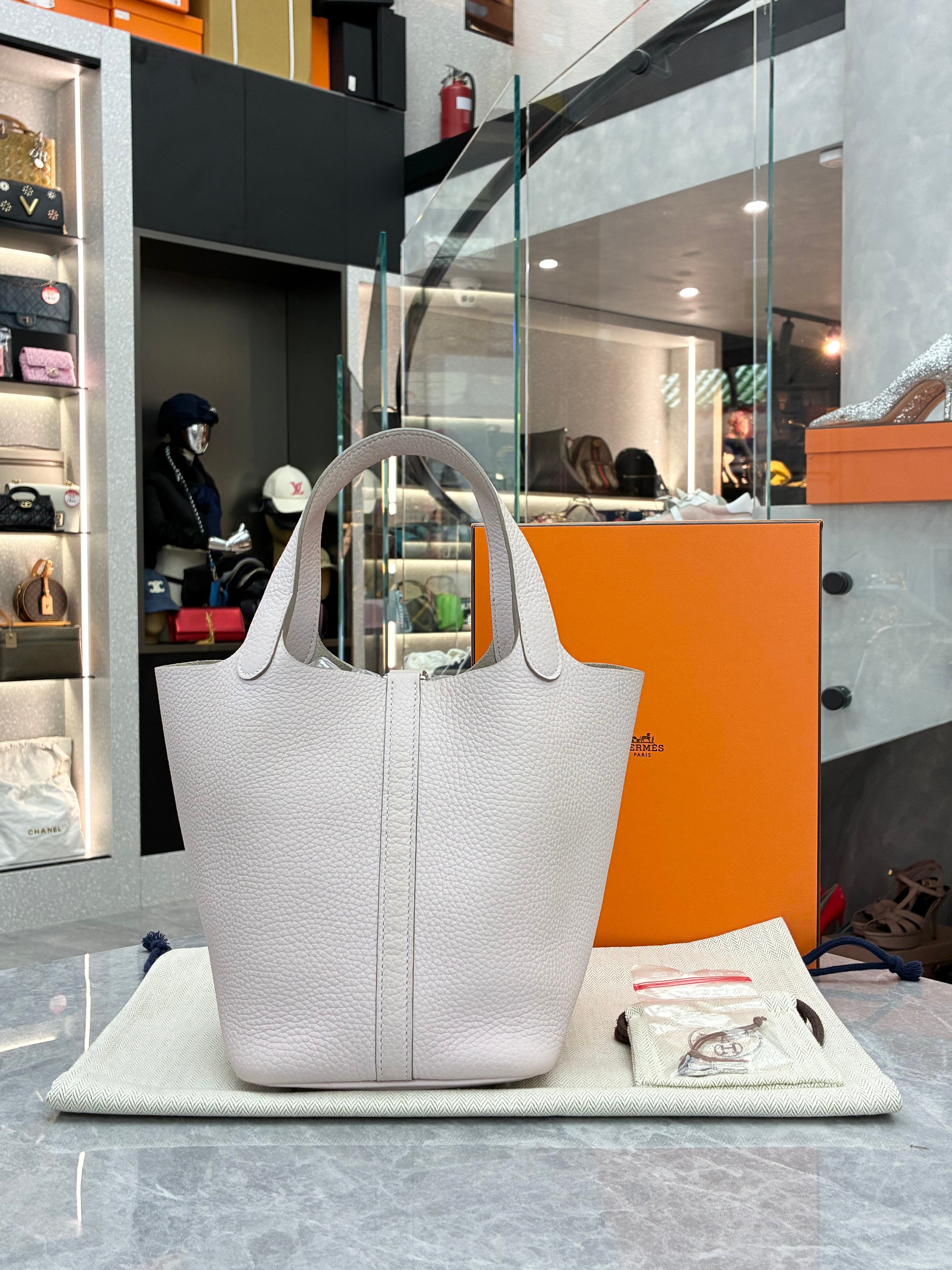 Hermès Picotin Lock 18 bag in a light grey color with silver hardware