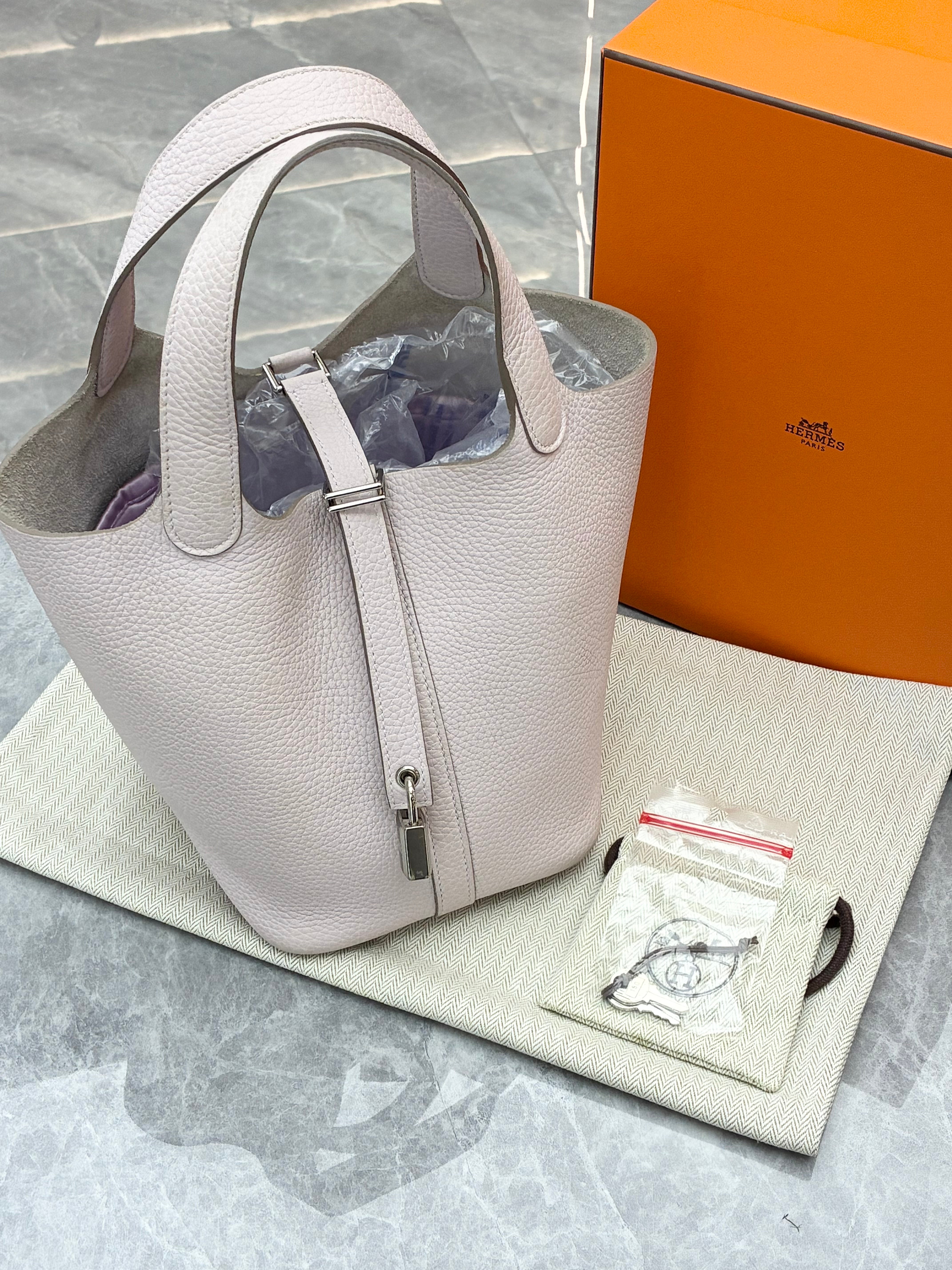 Hermès Picotin Lock 18 bag in a light grey color with silver hardware
