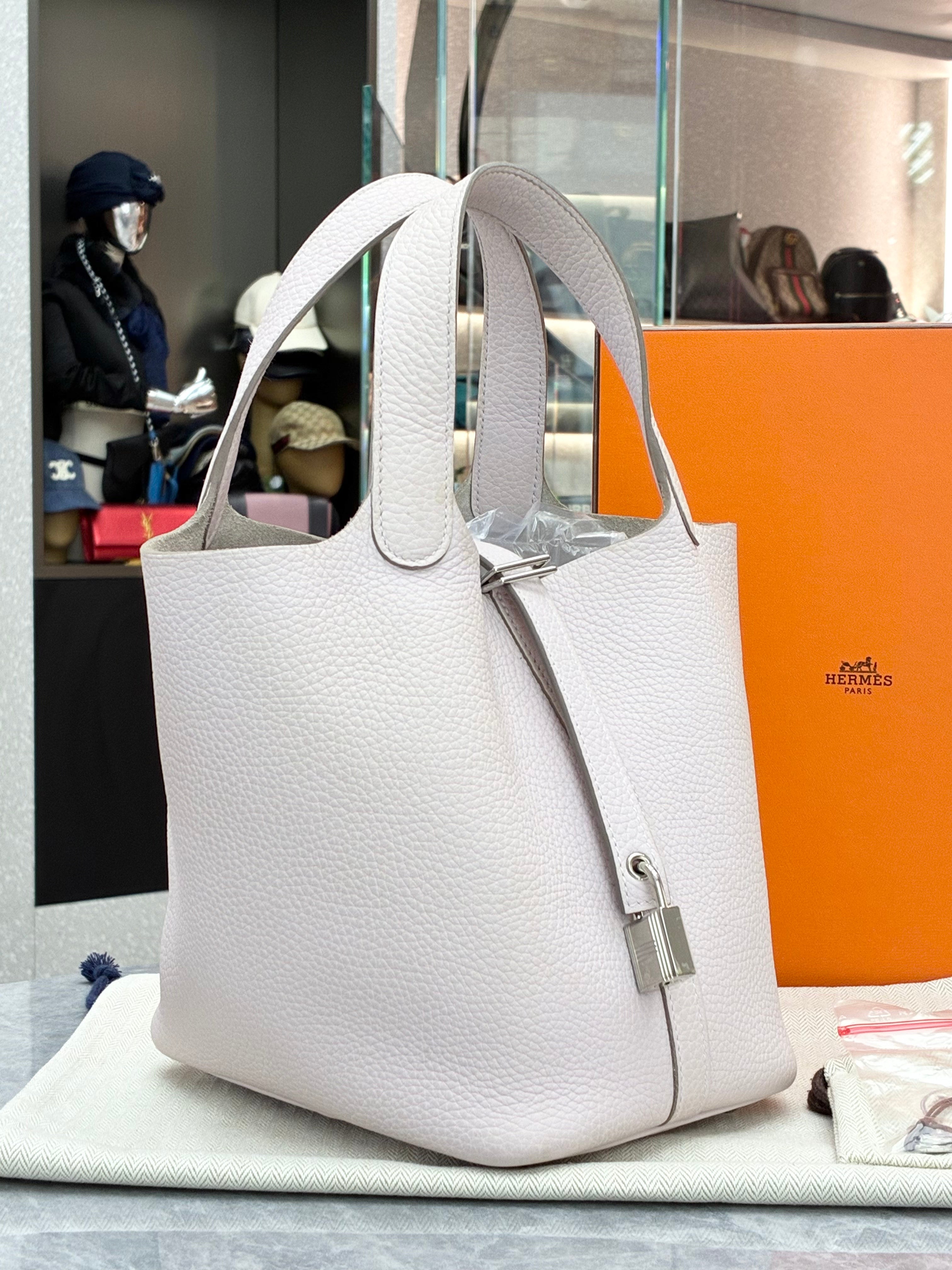 Hermès Picotin Lock 18 bag in a light grey color with silver hardware