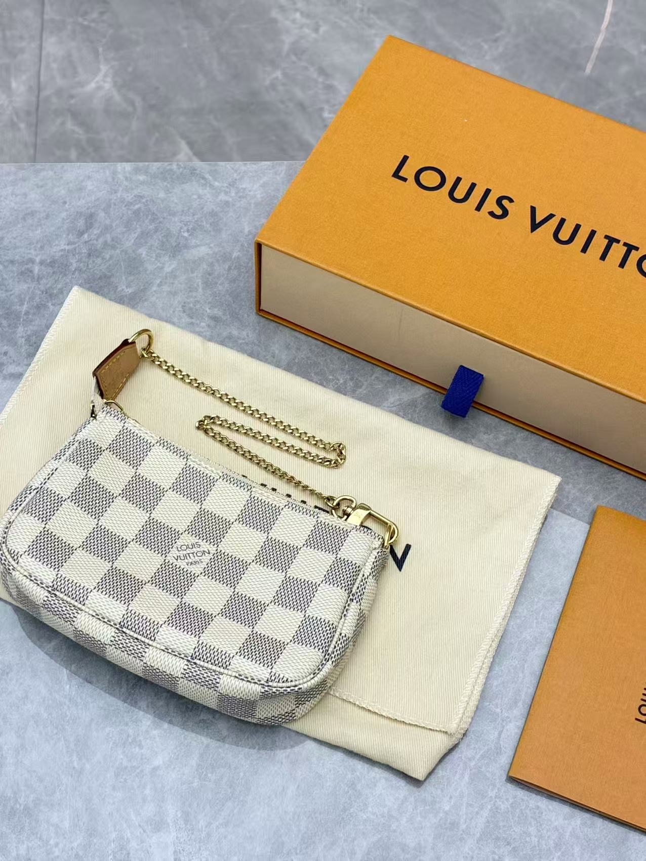 Louis Vuitton Mini Pochette Accessoires in Damier Azur canvas