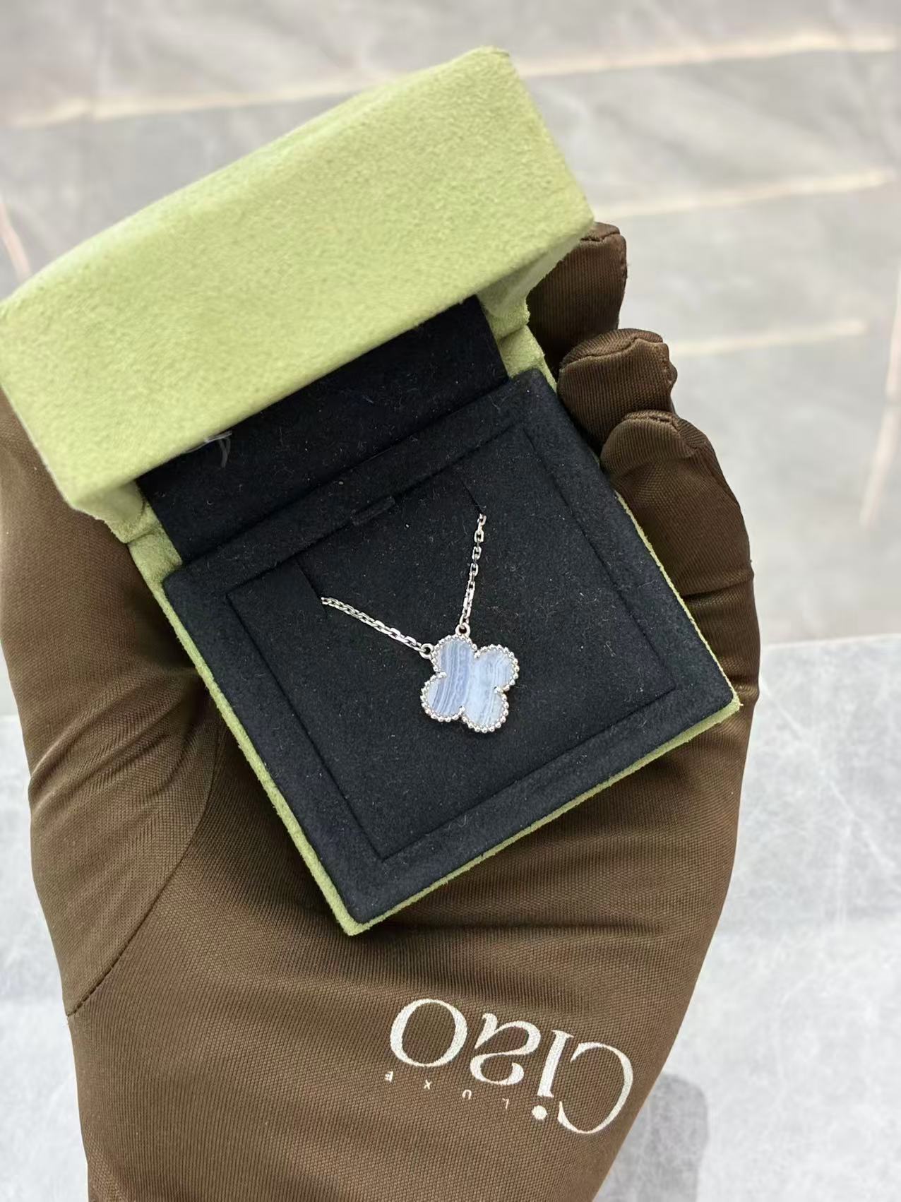 Van Cleef & Arpels Vintage Alhambra pendant necklace crafted in 18K white gold with chalcedony