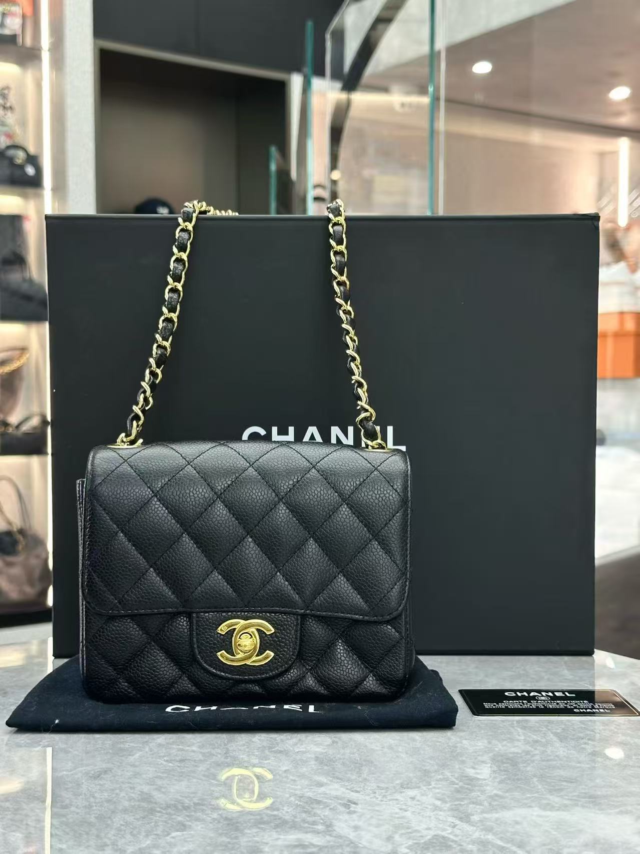 Chanel Classic Mini Square Flap bag made of black quilted caviar leather with gold-tone hardware