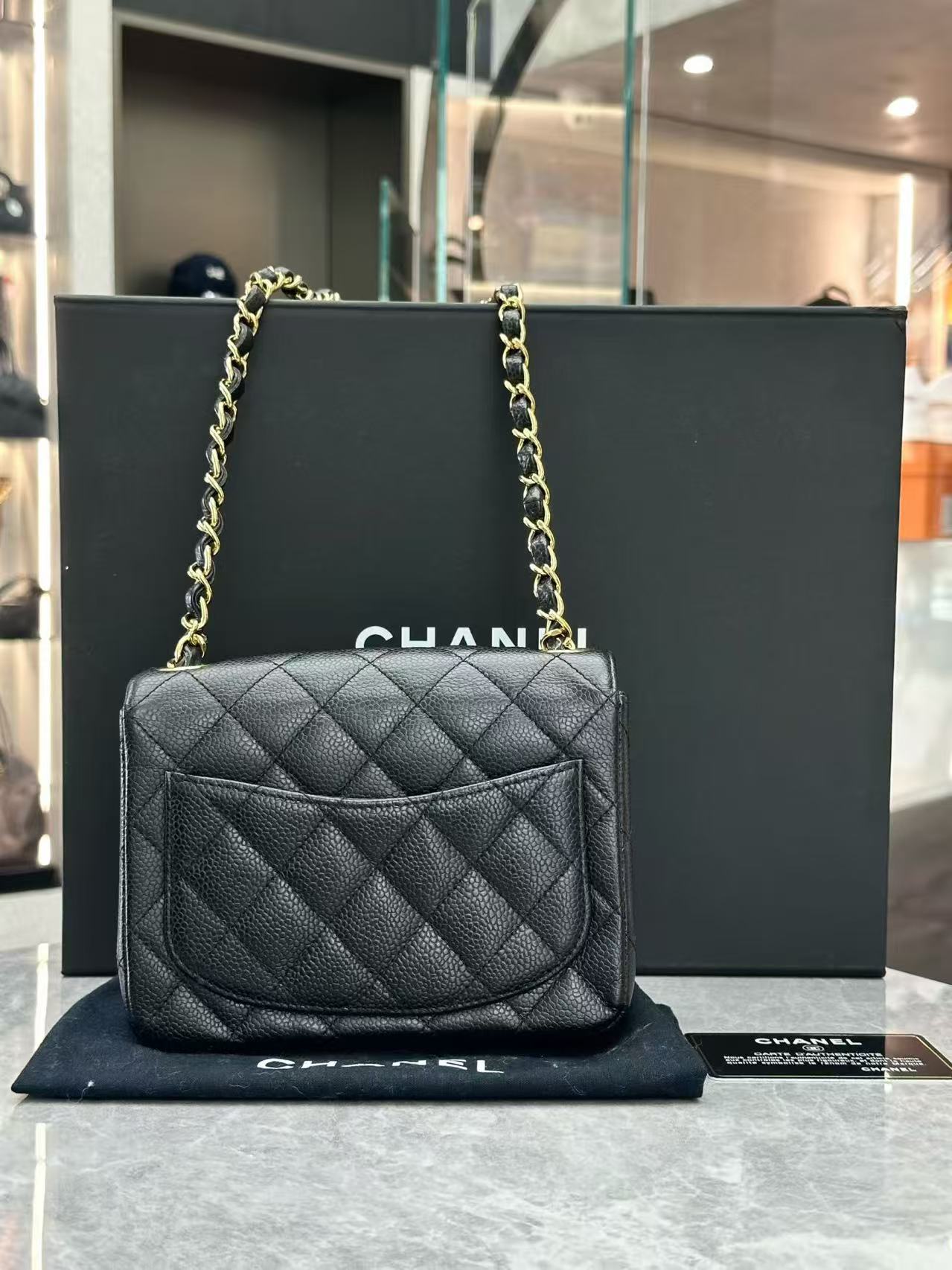 Chanel Classic Mini Square Flap bag made of black quilted caviar leather with gold-tone hardware