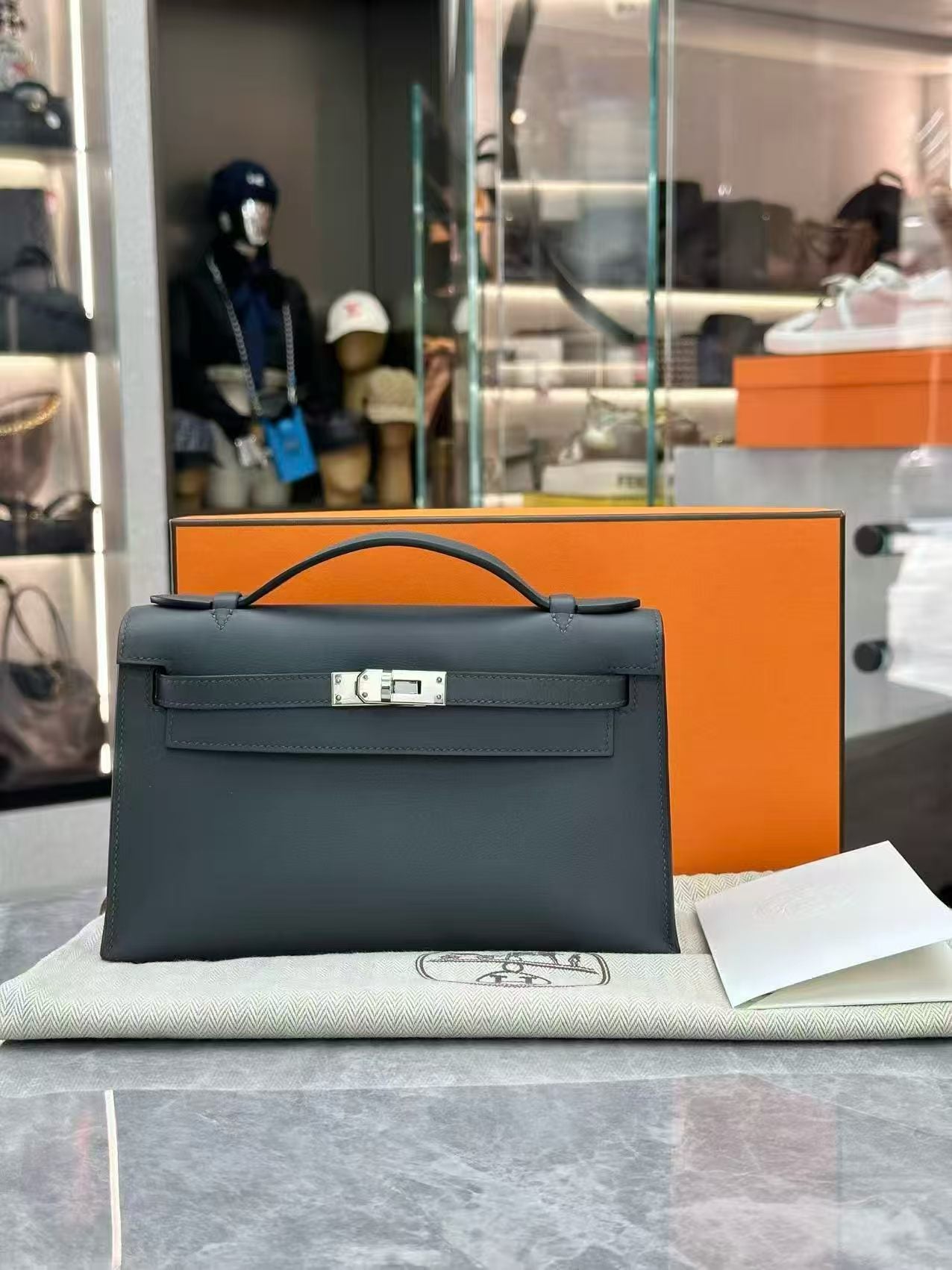 Hermès Kelly Pochette in Vert Mangrove Swift leather with Palladium hardware