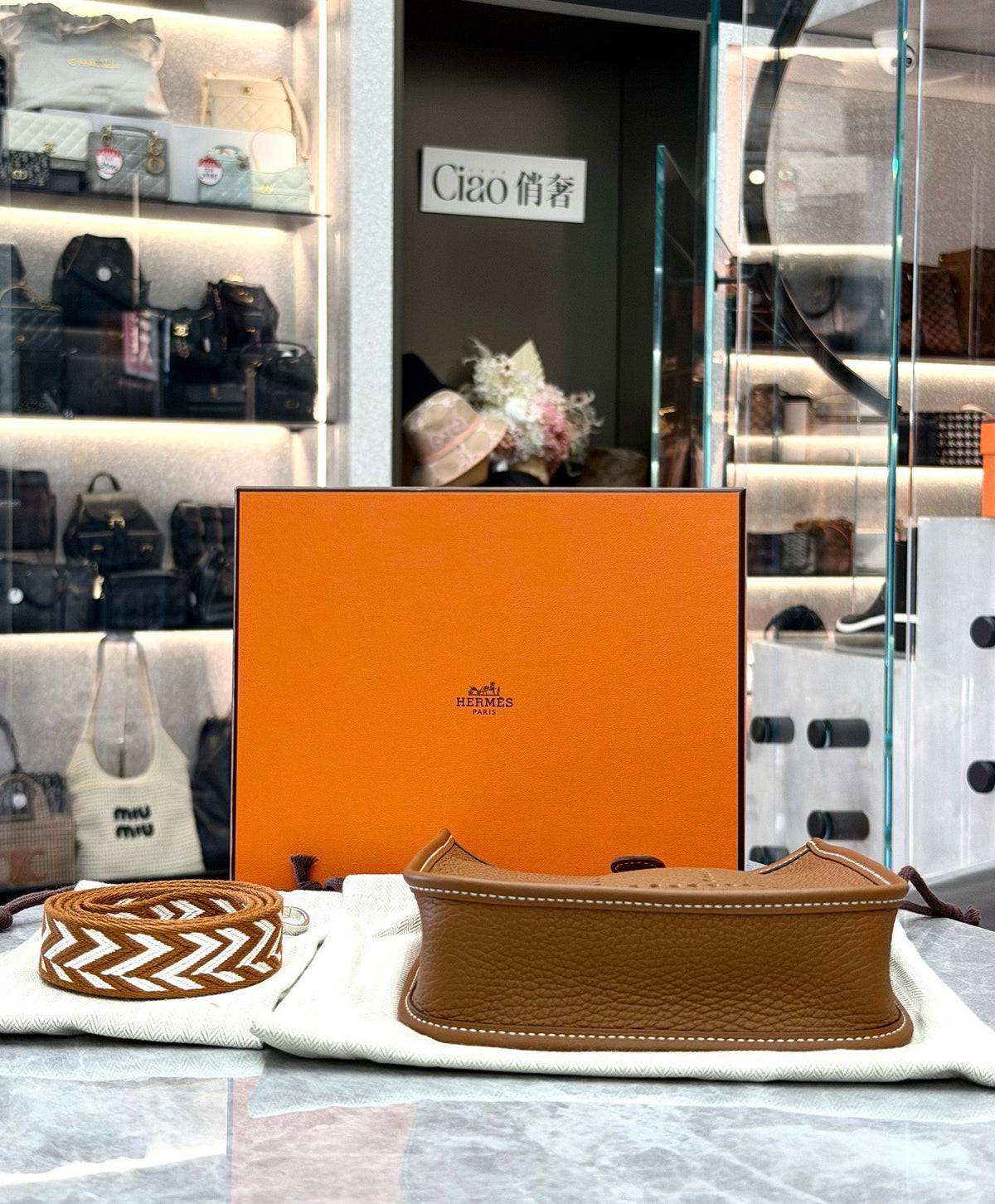 HERMÈS Mini Evelyne – Gold Taurillon Clemence, Palladium Hardware, Geometric Woven Strap, U Stamp, Brand New