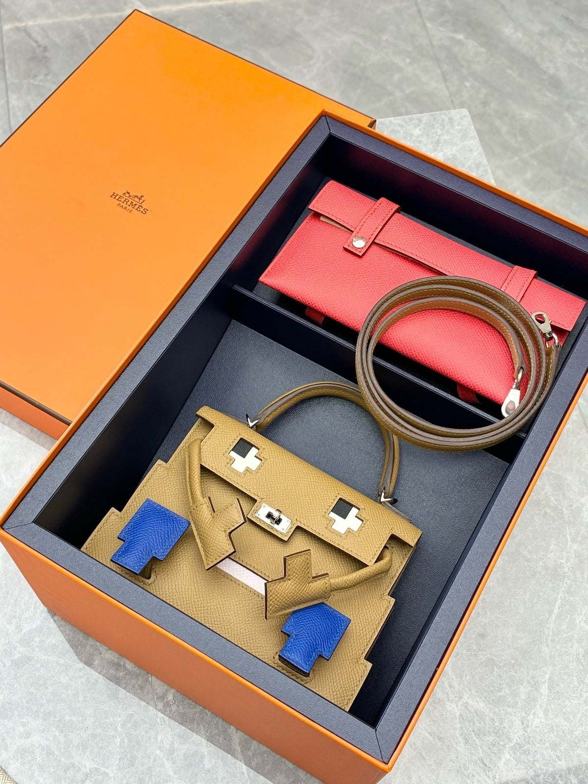HERMÈS Kelly Doll – Biscuit Epsom with Bleu France Pixel Mosaic, Palladium Hardware, W Stamp, Brand New