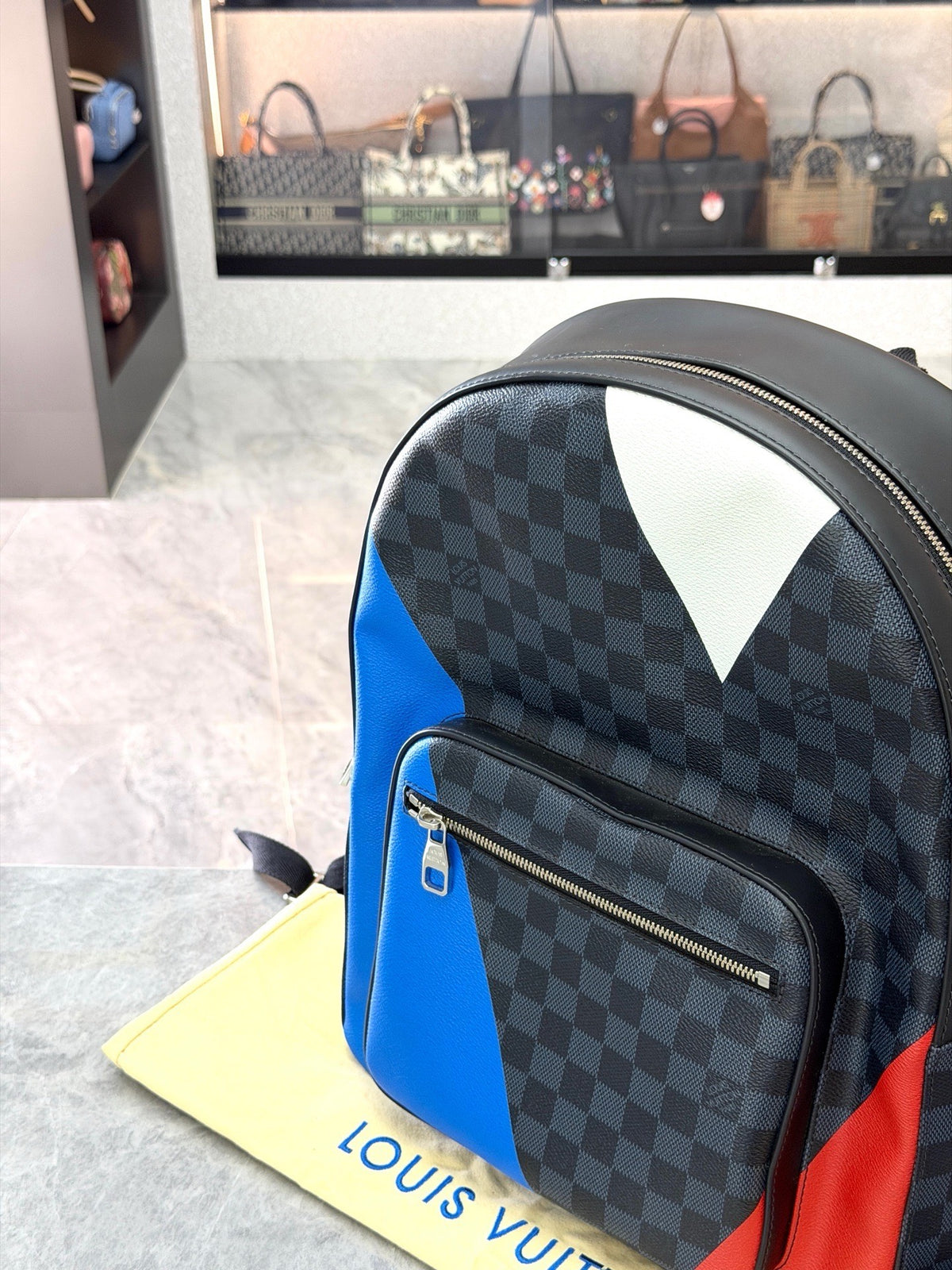LOUIS VUITTON Josh Backpack – Damier Graphite with Blue and Red Leather Panels, Excellent Pre-Owned