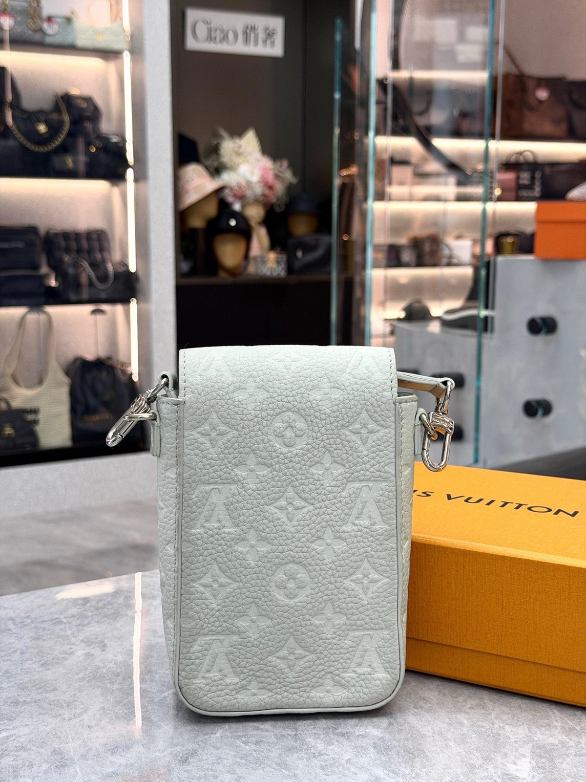 LOUIS VUITTON S-Lock Vertical – Pale Grey-Green Embossed Monogram Calfskin, Silver Hardware, Excellent Pre-Owned