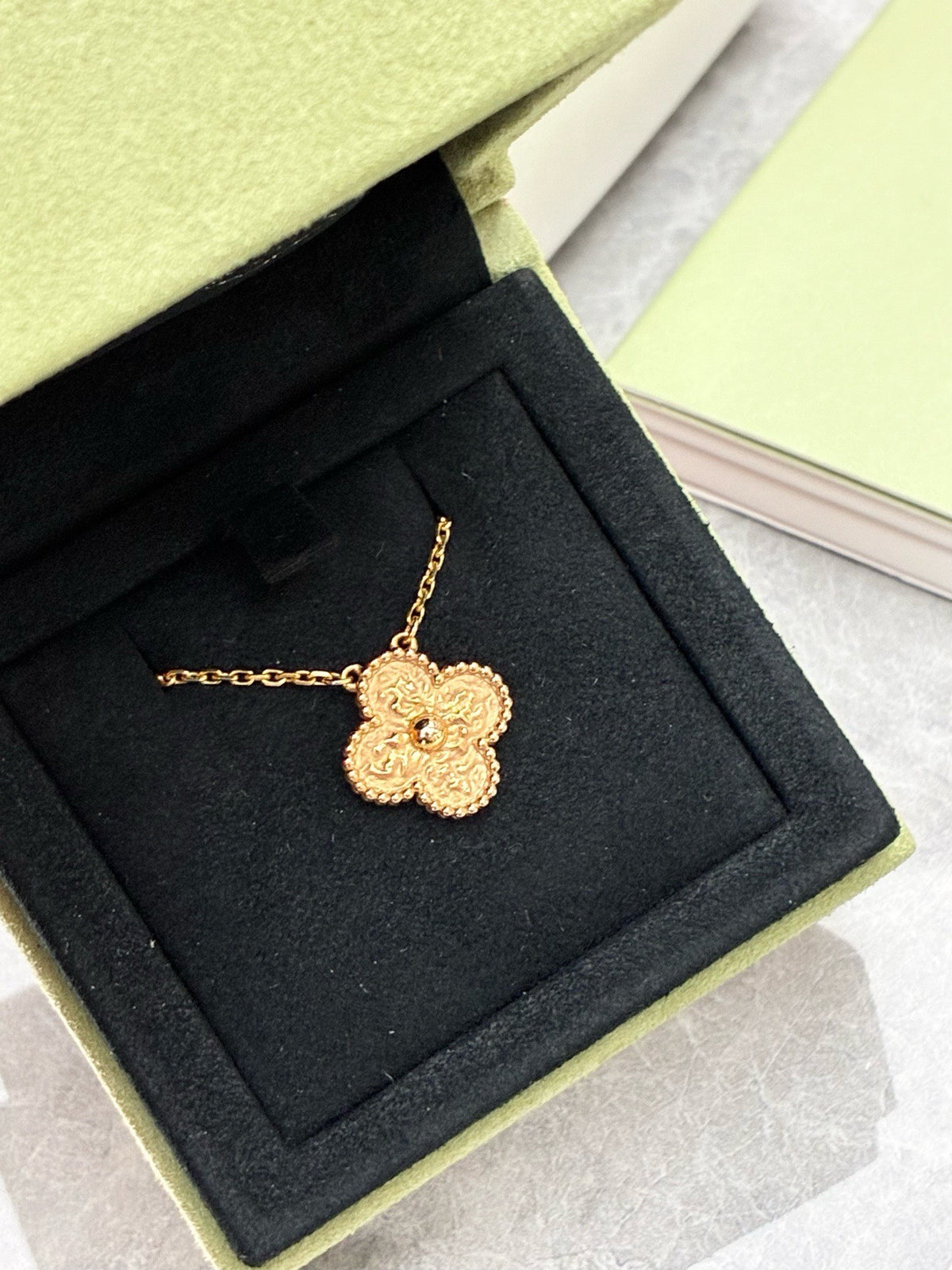 VAN CLEEF & ARPELS Vintage Alhambra Pendant – Yellow Gold with Textured Lava Finish, 2024 Warranty Card, Very Good Pre-Owned