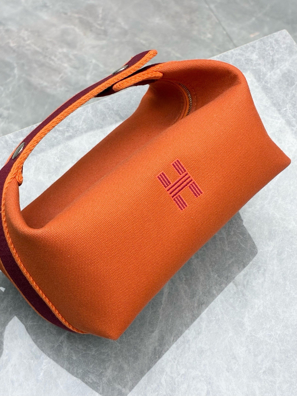 HERMÈS Bride-a-Brac PM – Flame Orange Canvas with Burgundy Webbing and Embroidered H, Good Pre-Owned
