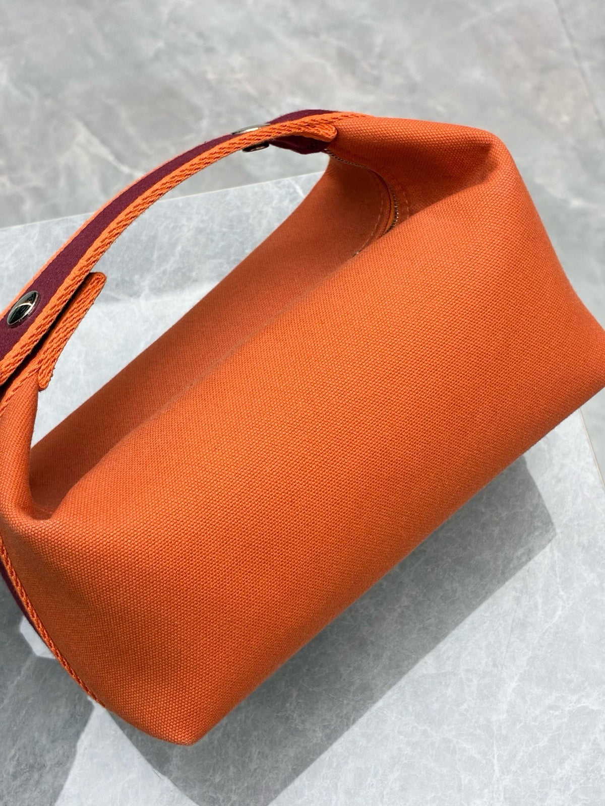 HERMÈS Bride-a-Brac PM – Flame Orange Canvas with Burgundy Webbing and Embroidered H, Good Pre-Owned