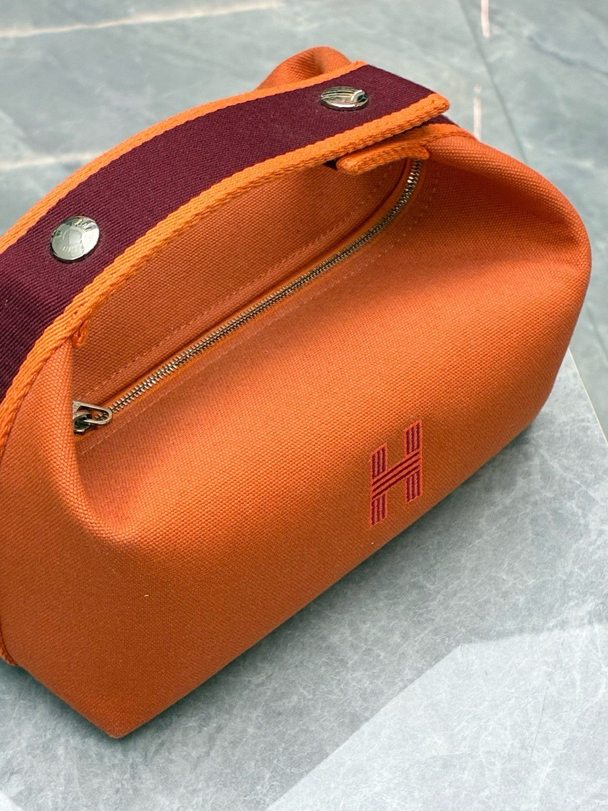 HERMÈS Bride-a-Brac PM – Flame Orange Canvas with Burgundy Webbing and Embroidered H, Good Pre-Owned