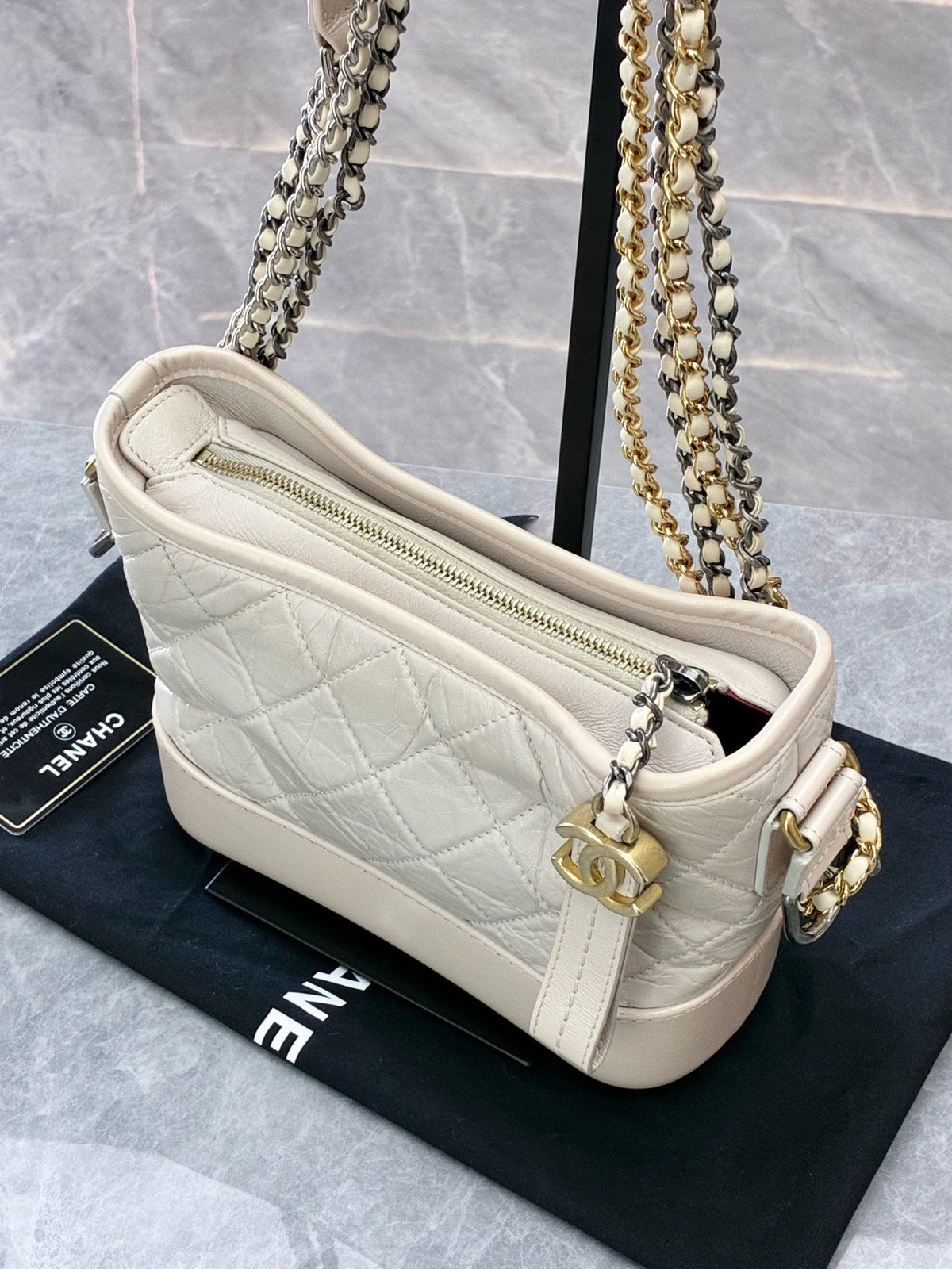 CHANEL Gabrielle Small Hobo – Cream Aged Calfskin with Mixed Gold and Silver Hardware, Series 26, Very Good Pre-Owned