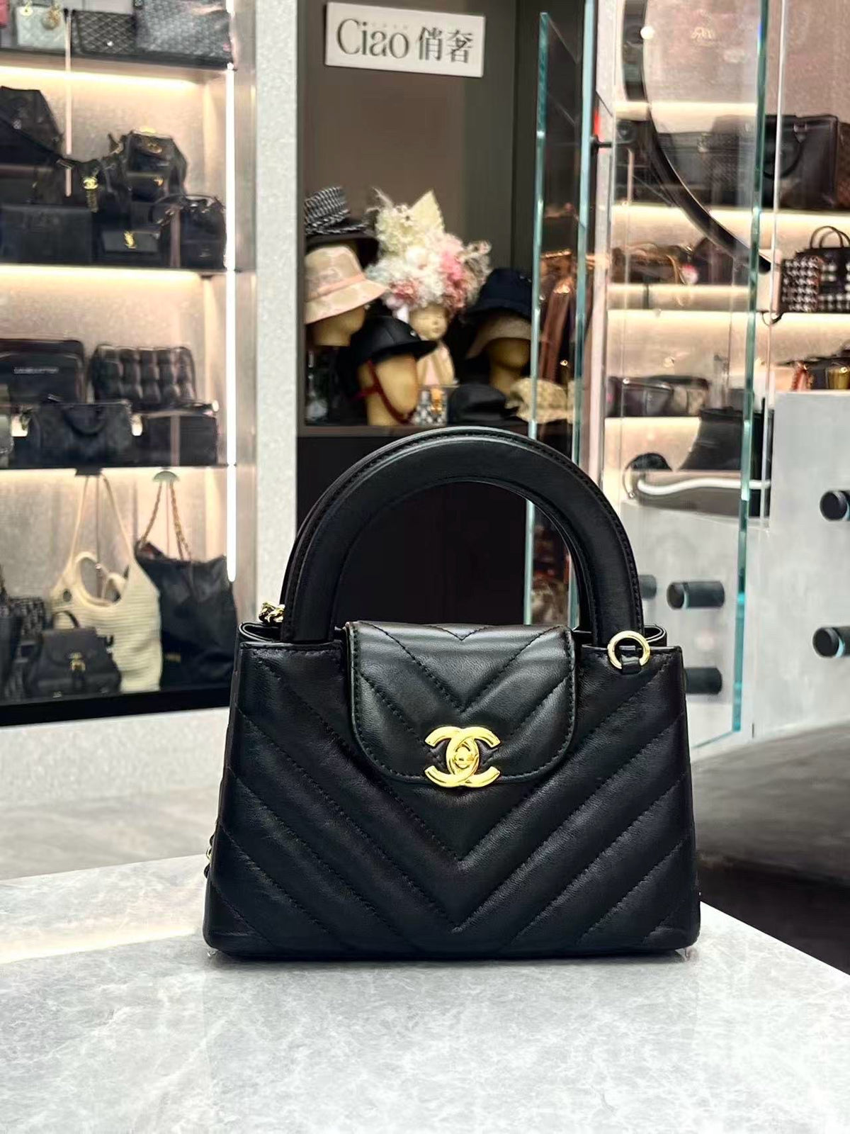 CHANEL Kelly Top Handle Flap – Black Chevron-Quilted Lambskin, Gold Hardware, Very Good Pre-Owned