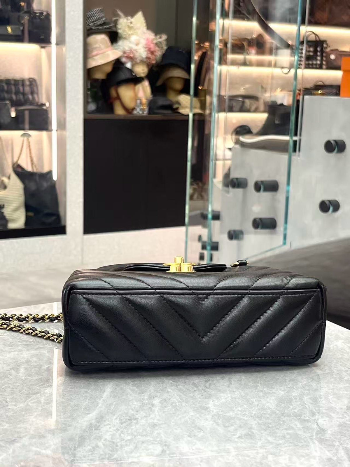 CHANEL Kelly Top Handle Flap – Black Chevron-Quilted Lambskin, Gold Hardware, Very Good Pre-Owned