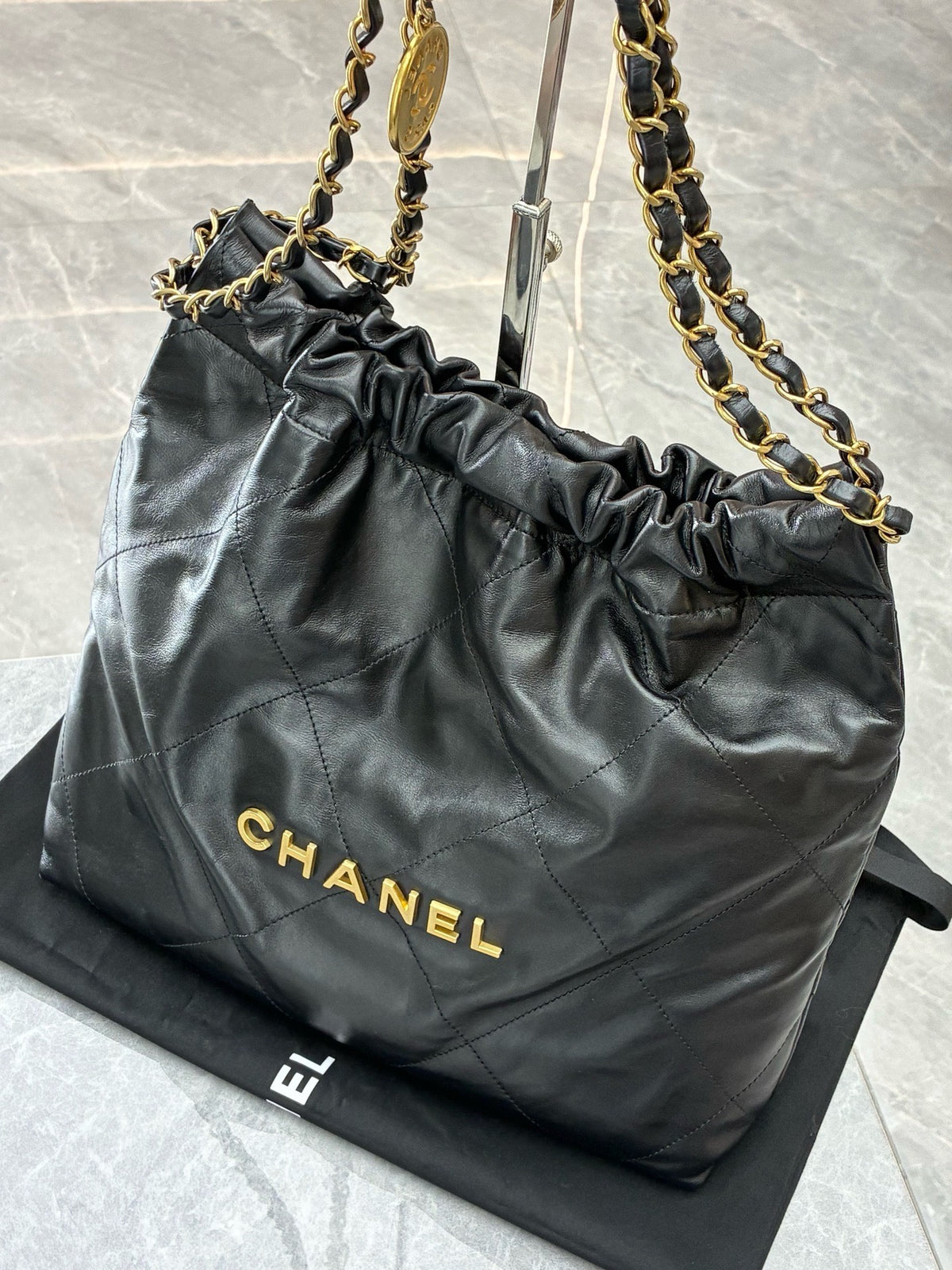 CHANEL 22 Small Hobo – Black Shiny Calfskin with Gold Hardware and Gilded CHANEL Letters, Excellent Pre-Owned