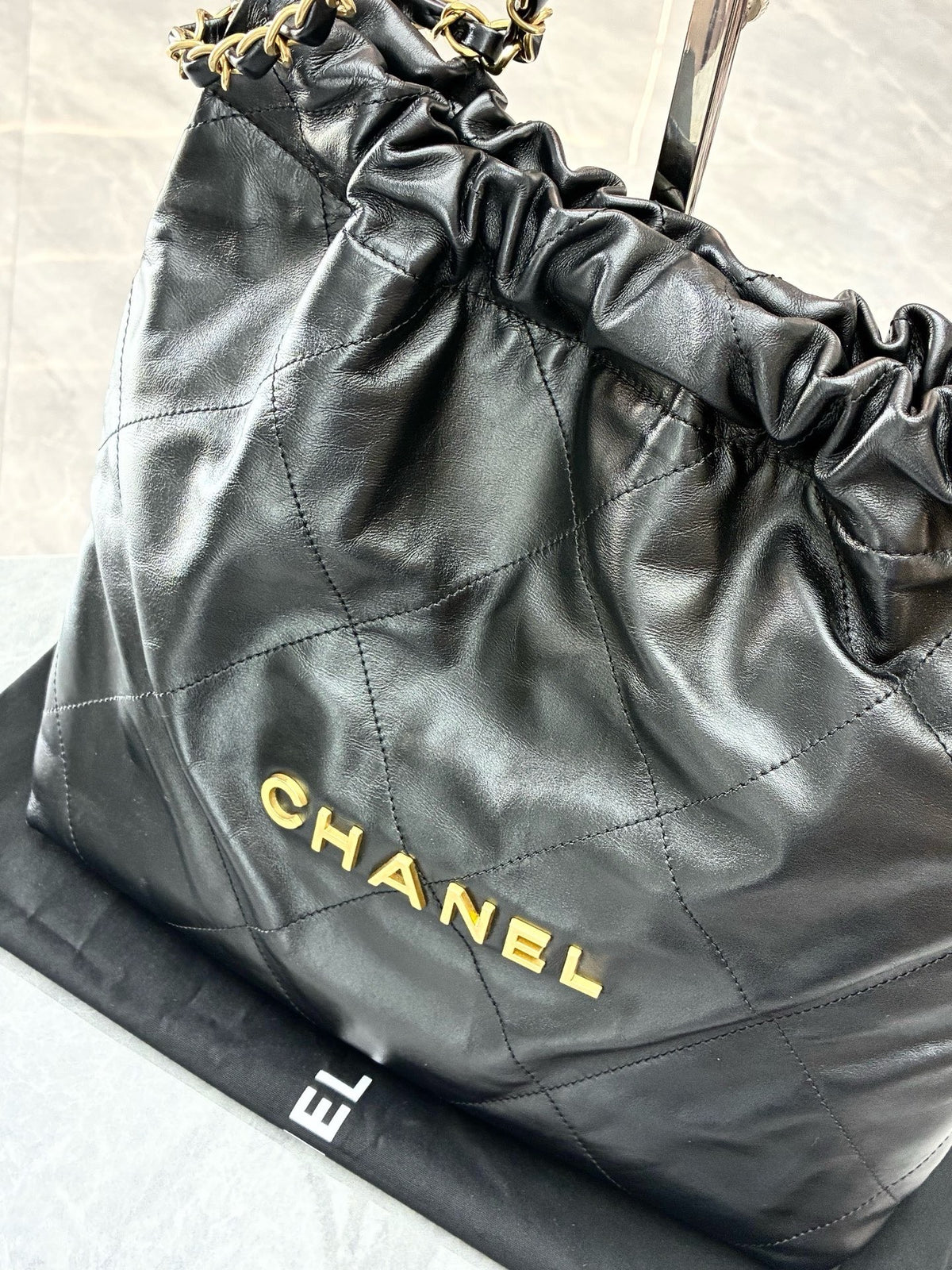 CHANEL 22 Small Hobo – Black Shiny Calfskin with Gold Hardware and Gilded CHANEL Letters, Excellent Pre-Owned