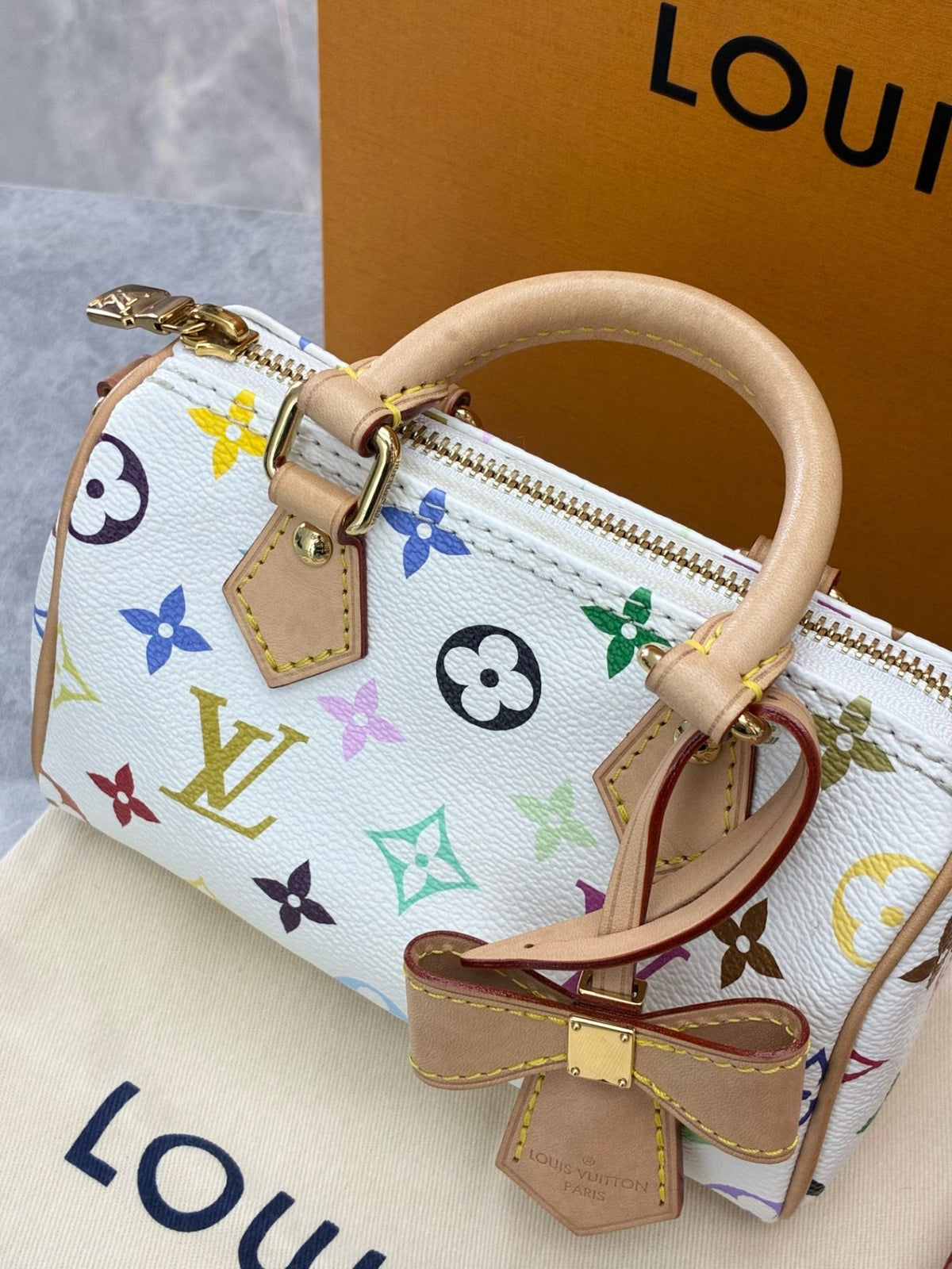 LOUIS VUITTON Nano Speedy – White Multicolor Monogram Canvas, Vachetta Trim, Gold Hardware, Microchip Era, Good Pre-Owned
