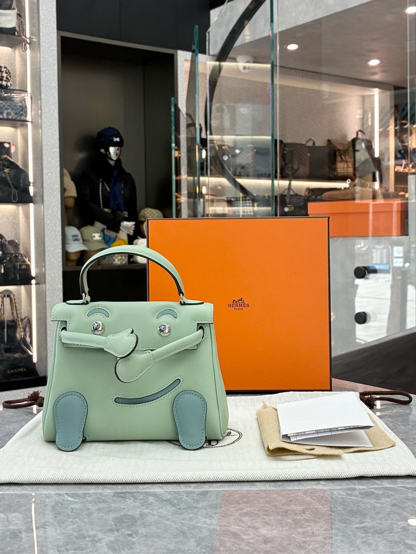 Hermès Kelly Doll in Vert Menthe Swift leather with Bleu Atoll details, full set