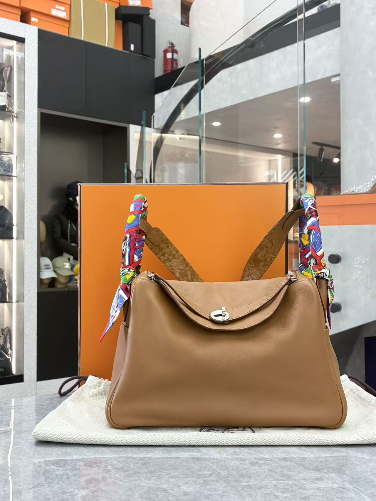 Hermès Lindy 30 Gold Swift leather with limited-edition woven strap front view