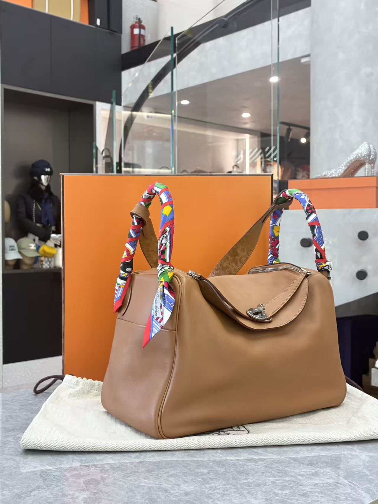 Hermès Lindy 30 Gold Swift leather with limited-edition woven strap side view